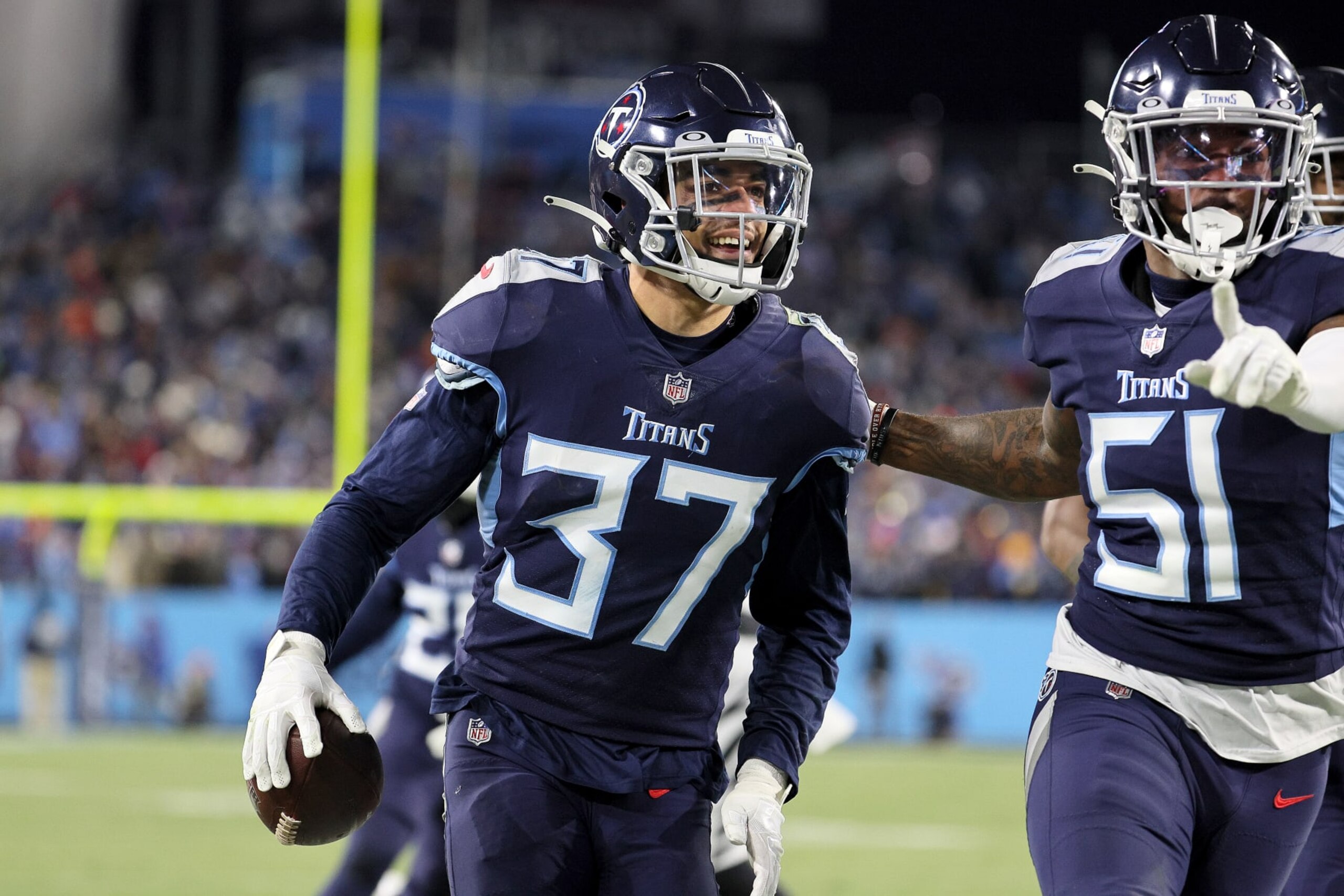 NASHVILLE, TENNESSEE - JANUARY 22: Safety Amani Hooker #37 of the Tennessee Titans celebrates after intercepting a Cincinnati Bengals pass in the second half during the AFC Divisional Playoff game at Nissan Stadium on January 22, 2022 in Nashville, Tennessee. (Photo by Andy Lyons/Getty Images) NASHVILLE, TENNESSEE - JANUARY 22: Safety Amani Hooker #37 of the Tennessee Titans celebrates after intercepting a Cincinnati Bengals pass in the second half during the AFC Divisional Playoff game at Nissan Stadium on January 22, 2022 in Nashville, Tennessee. (Photo by Andy Lyons/Getty Images)