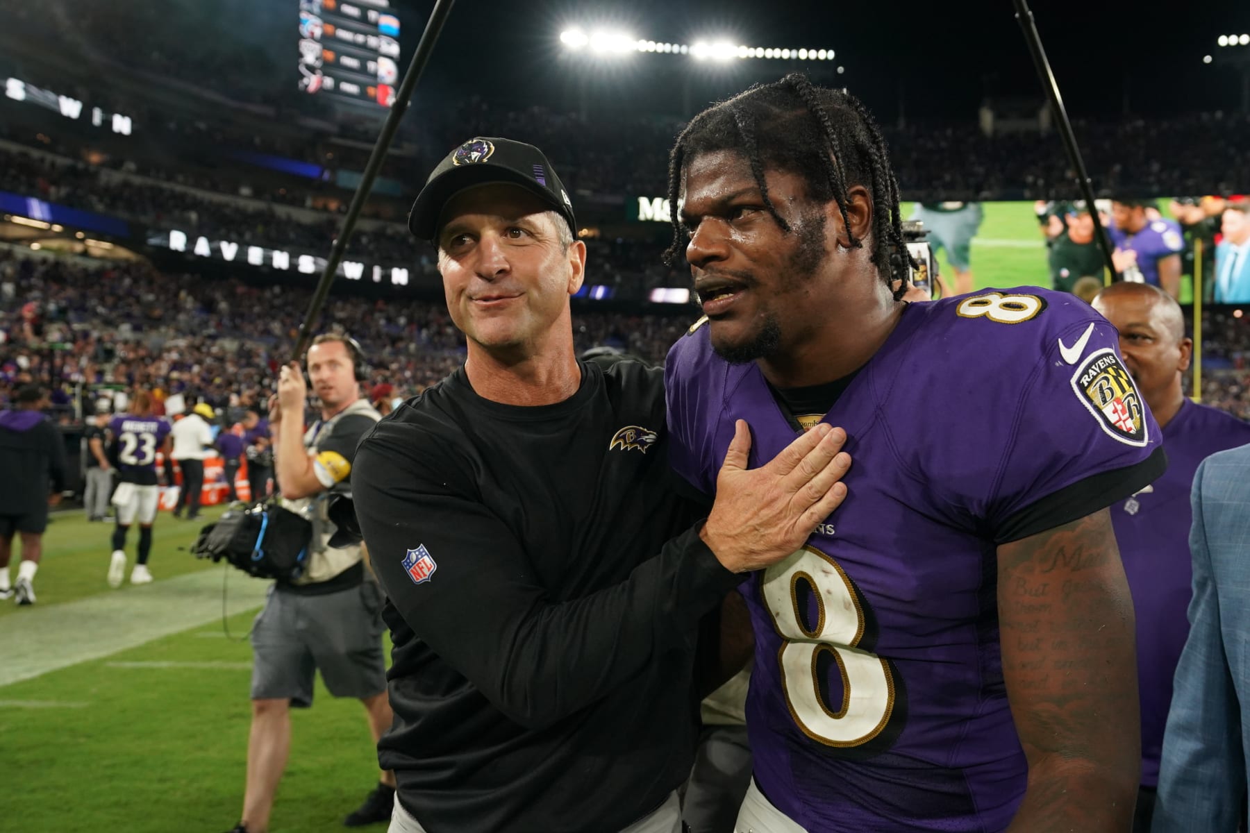 BALTIMORE, MARYLAND - SEPTEMBER 19: Lamar Jackson #8 of the Baltimore Ravens hugs head coach John Harbaugh against the Kansas City Chiefs after an NFL game at M&T Bank Stadium on September 19, 2021 in Baltimore, Maryland. (Photo by Cooper Neill/Getty Images)