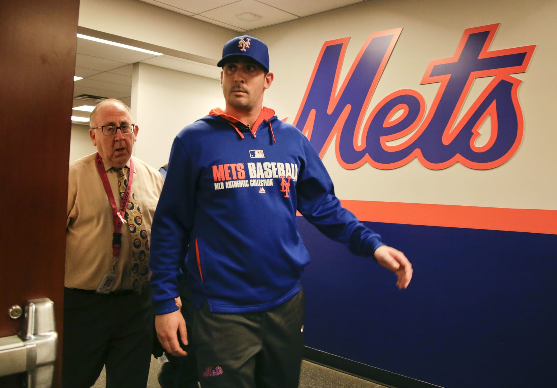 New York Mets pitcher Matt Harvey arrives at the team clubhouse to talk to members of the media at CitiField, Wednesday, Dec. 3, 2014, in New York. Harvey hasn't pitched in a game since Aug. 24, 2013, and the right-hander is recovering from elbow ligament-replacement surgery on Oct. 22. The ace is willing to accept limits on his starts and innings next year in order to able to pitch in the playoffs if New York makes it that far for the first time since 2006. (AP Photo/Julie Jacobson)