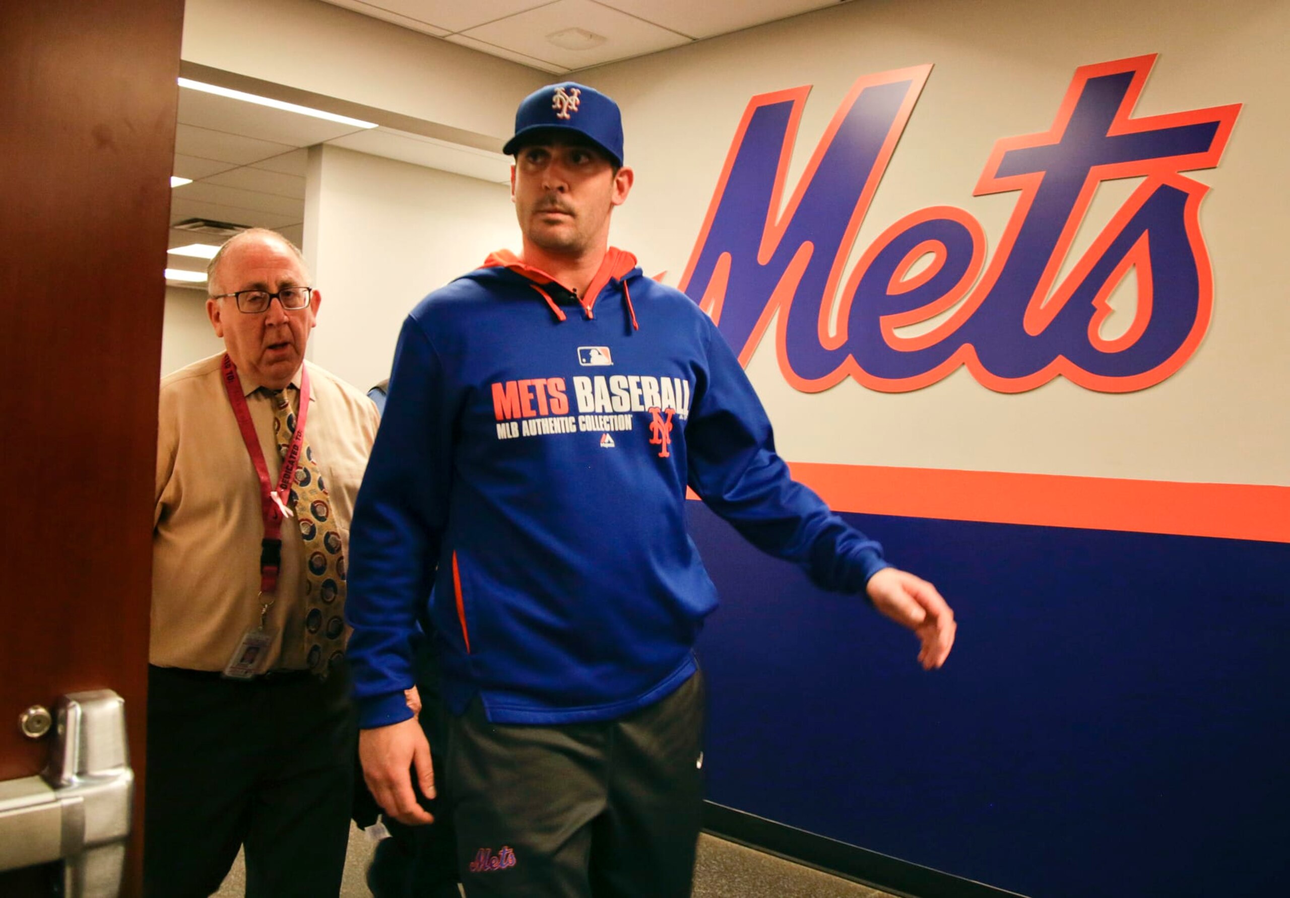 New York Mets pitcher Matt Harvey arrives at the team clubhouse to talk to members of the media at CitiField, Wednesday, Dec. 3, 2014, in New York. Harvey hasn't pitched in a game since Aug. 24, 2013, and the right-hander is recovering from elbow ligament-replacement surgery on Oct. 22. The ace is willing to accept limits on his starts and innings next year in order to able to pitch in the playoffs if New York makes it that far for the first time since 2006. (AP Photo/Julie Jacobson)