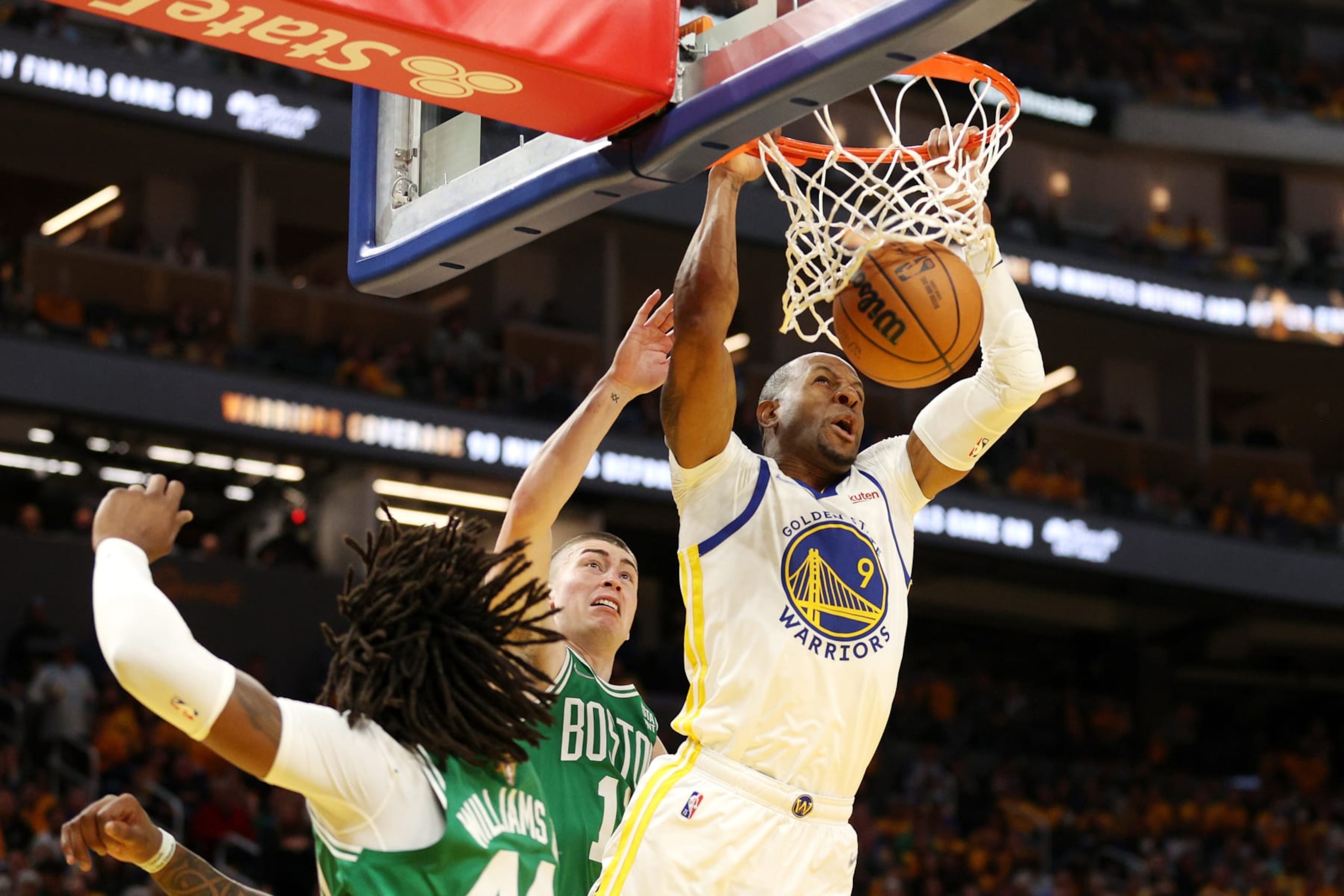 SAN FRANCISCO, CALIFORNIA - JUNE 02: Andre Iguodala #9 of the Golden State Warriors dunks the ball past Payton Pritchard #11 and Robert Williams III #44 of the Boston Celtics during the fourth quarter in Game One of the 2022 NBA Finals at Chase Center on June 02, 2022 in San Francisco, California. NOTE TO USER: User expressly acknowledges and agrees that, by downloading and/or using this photograph, User is consenting to the terms and conditions of the Getty Images License Agreement. (Photo by Ezra Shaw/Getty Images) SAN FRANCISCO, CALIFORNIA - JUNE 02: Andre Iguodala #9 of the Golden State Warriors dunks the ball past Payton Pritchard #11 and Robert Williams III #44 of the Boston Celtics during the fourth quarter in Game One of the 2022 NBA Finals at Chase Center on June 02, 2022 in San Francisco, California. NOTE TO USER: User expressly acknowledges and agrees that, by downloading and/or using this photograph, User is consenting to the terms and conditions of the Getty Images License Agreement. (Photo by Ezra Shaw/Getty Images)