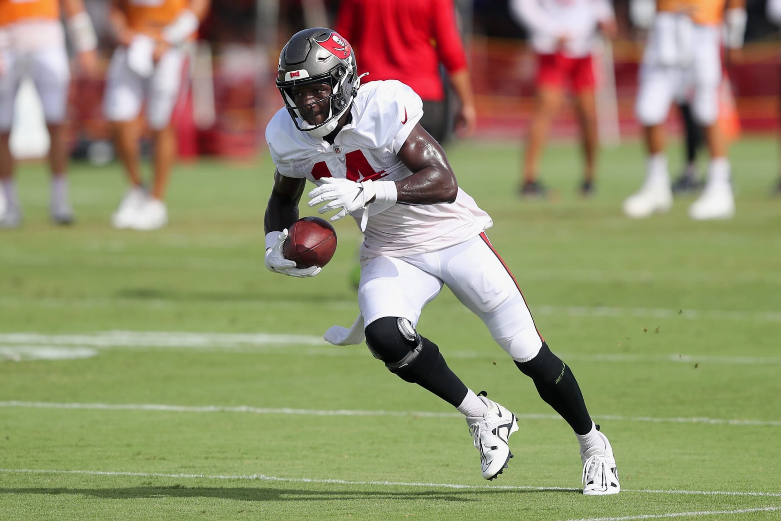 TAMPA, FL - AUG 10: Tampa Bay Buccaneers wide receiver Chris Godwin (14) runs with the ball after making catch during the Tampa Bay Buccaneers & Miami Dolphins Joint-Practice on August 10, 2022 at the AdventHealth Training Center at One Buccaneer Place in Tampa, Florida. (Photo by Cliff Welch/Icon Sportswire via Getty Images)
