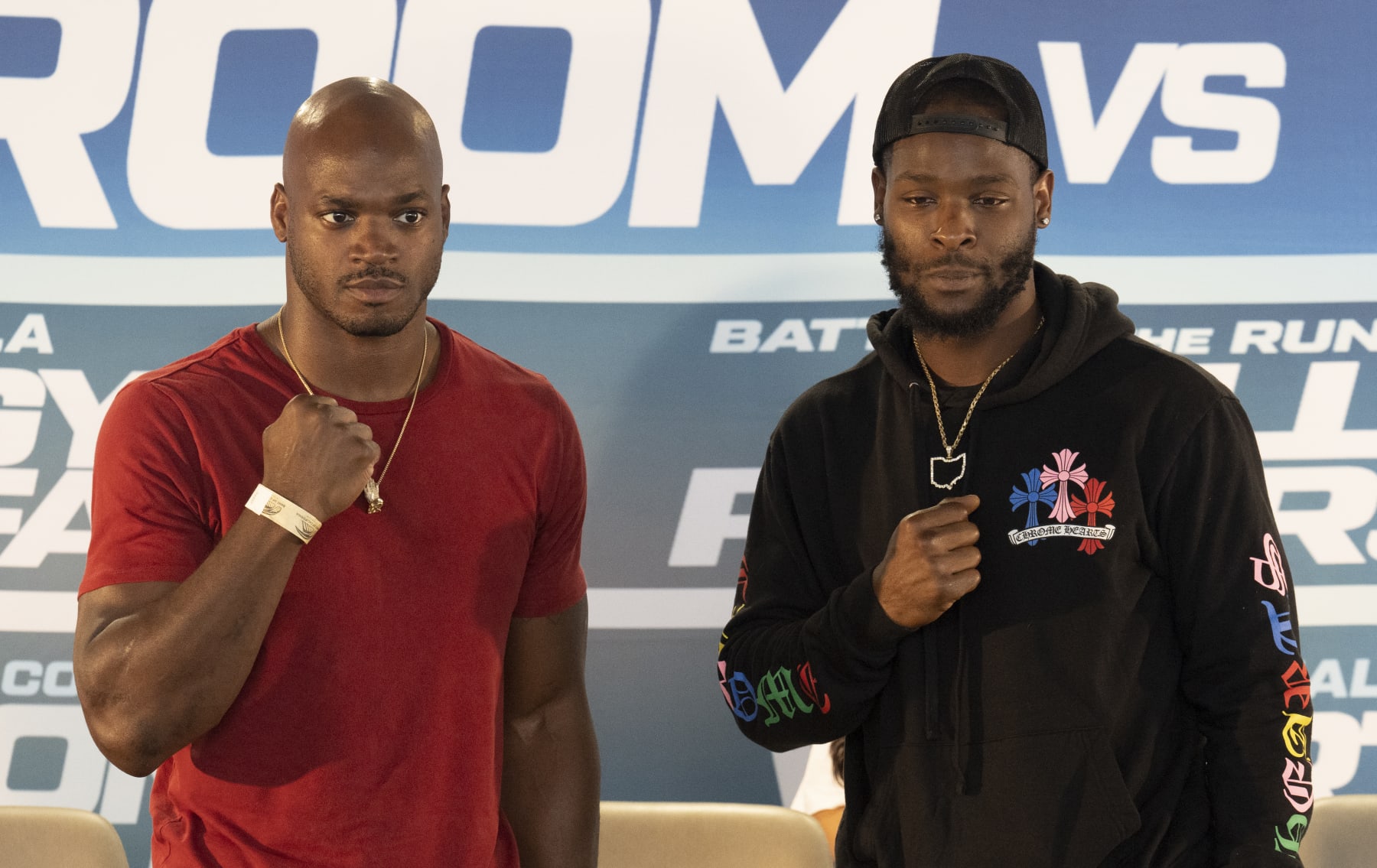 LOS ANGELES, CA - SEPTEMBER 08: Former NFL players Adrian Peterson (L) and LeVeon Bell talk about their upcoming fight at the Banc of California Stadium on September 8, 2022 in Los Angeles, California. (Photo by John McCoy/Getty Images)