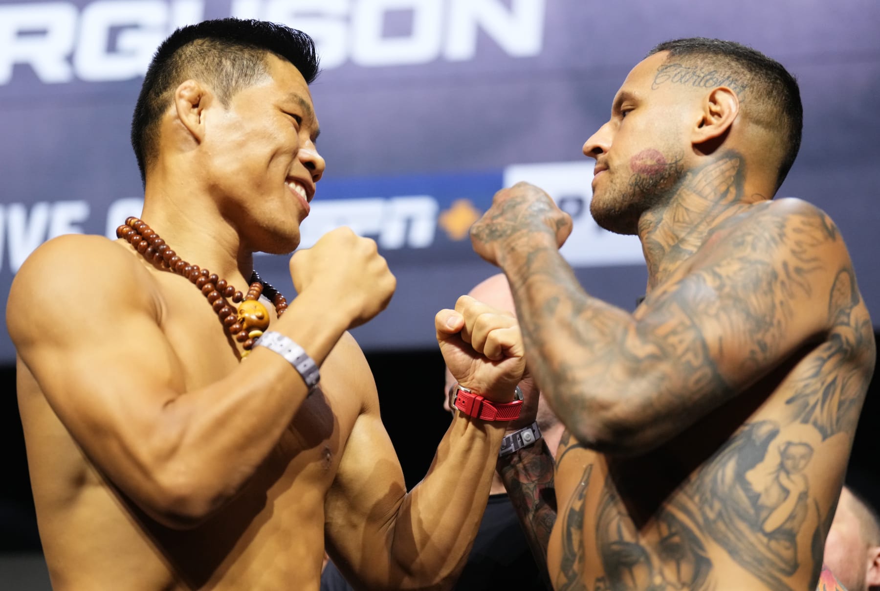 LAS VEGAS, NEVADA - SEPTEMBER 09: (L-R) Opponents Li Jingliang of China and Daniel Rodriguez face off during the UFC 279 ceremonial weigh-in at MGM Grand Garden Arena on September 09, 2022 in Las Vegas, Nevada. (Photo by Chris Unger/Zuffa LLC)