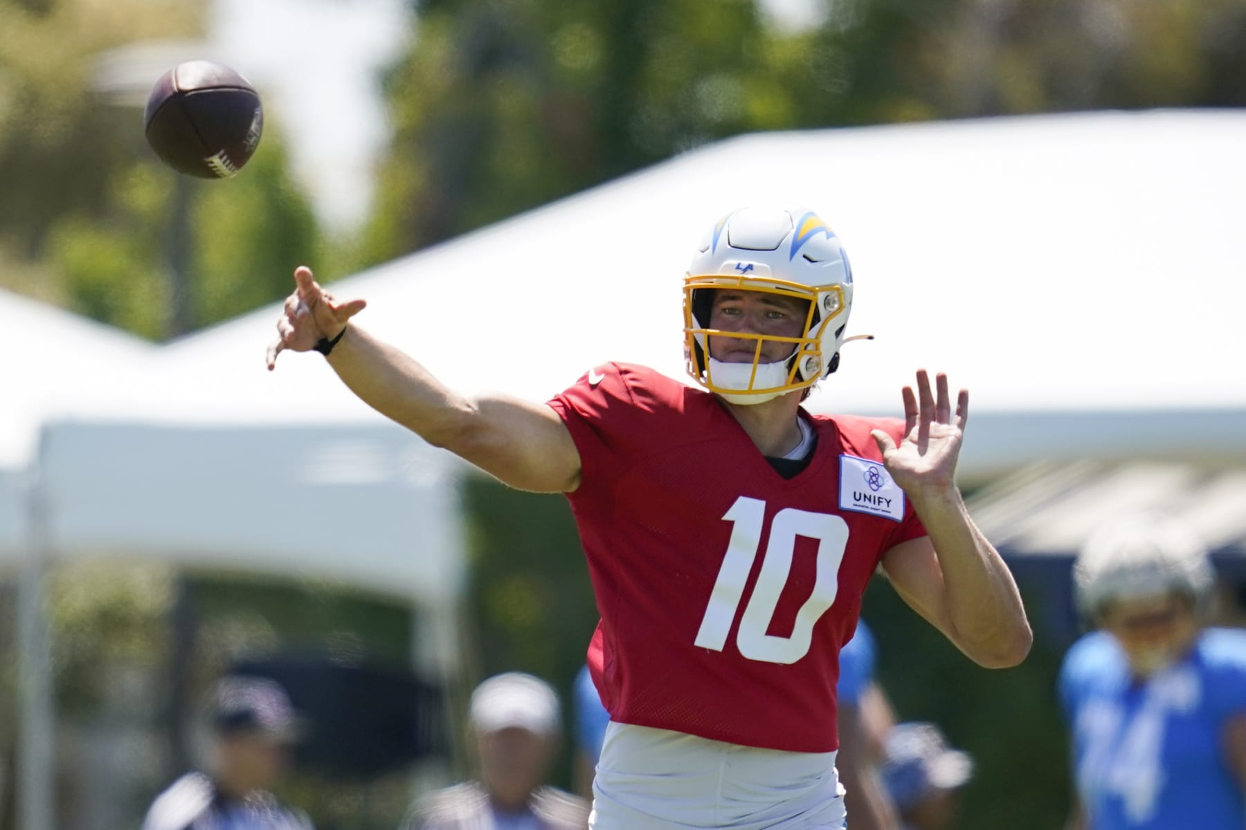 Los Angeles Chargers quarterback Justin Herbert (10) participates in drills during a combined NFL practice with the Dallas Cowboys at the Los Angeles Rams' practice facility in Costa Mesa, Calif. Wednesday, Aug. 17, 2022. (AP Photo/Ashley Landis)