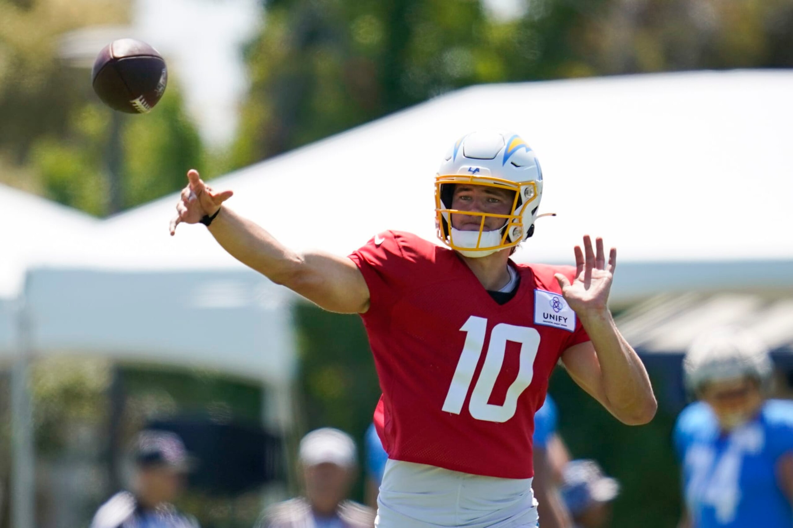 Los Angeles Chargers quarterback Justin Herbert (10) participates in drills during a combined NFL practice with the Dallas Cowboys at the Los Angeles Rams' practice facility in Costa Mesa, Calif. Wednesday, Aug. 17, 2022. (AP Photo/Ashley Landis)