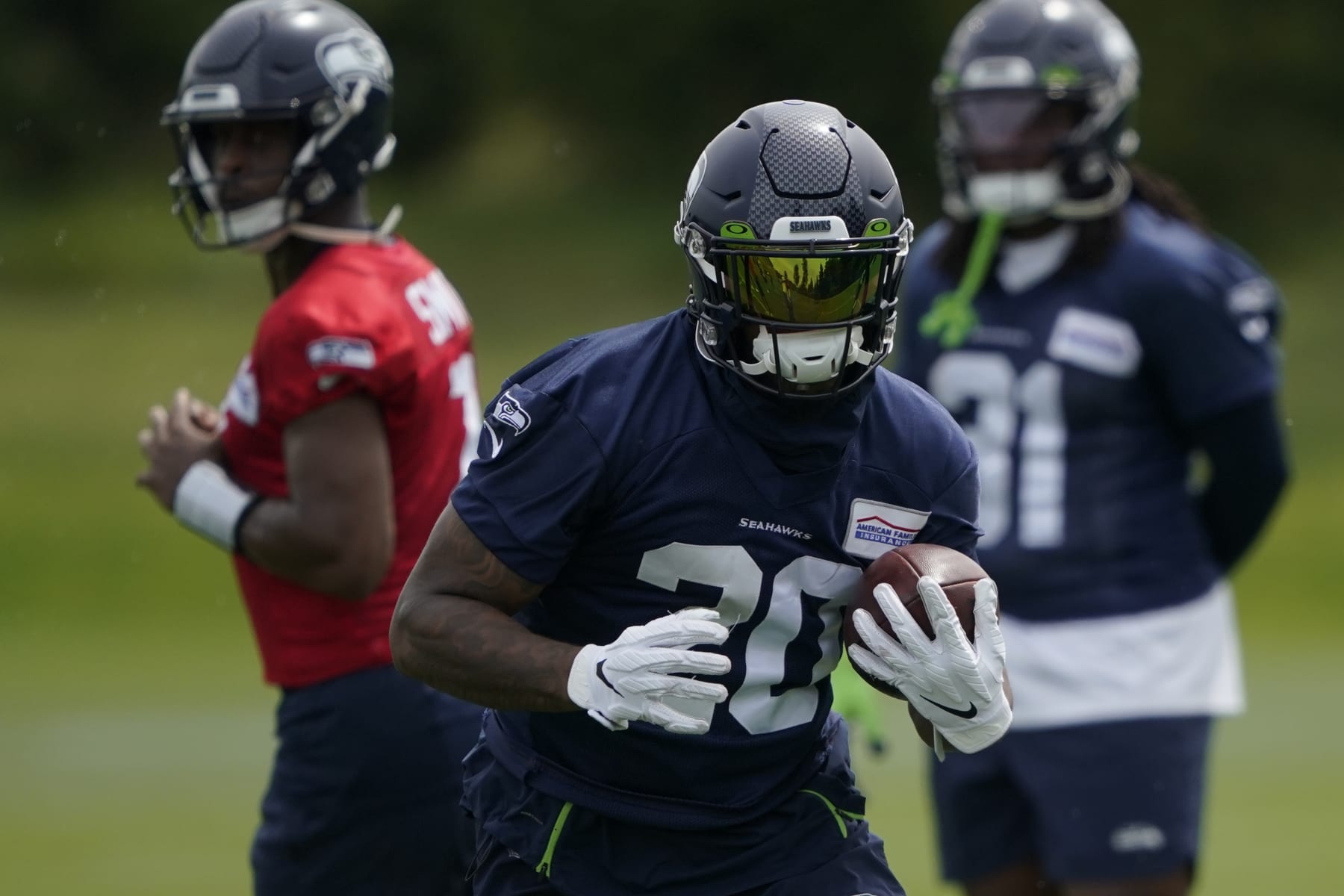 Seattle Seahawks running back Rashaad Penny runs a drill during NFL football practice Wednesday, June 8, 2022, in Renton, Wash. (AP Photo/Ted S. Warren)