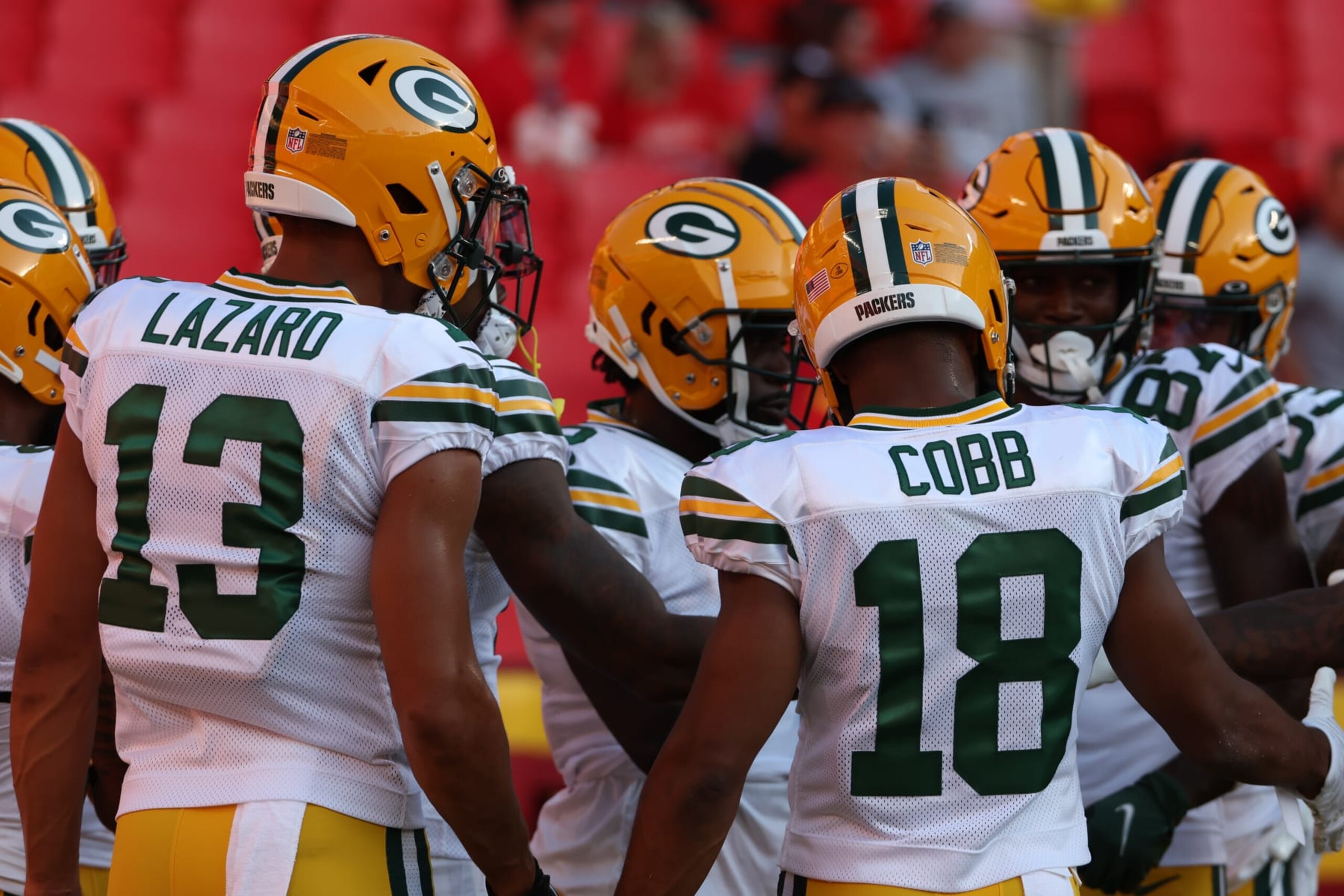 KANSAS CITY, MO - AUGUST 25: Green Bay Packers wide receivers Allen Lazard (13) and Randall Cobb (18) in a huddle before an NFL preseason game between the Green Bay Packers and Kansas City Chiefs on August 25, 2022 at GEHA Field at Arrowhead Stadium in Kansas City, MO. (Photo by Scott Winters/Icon Sportswire via Getty Images)