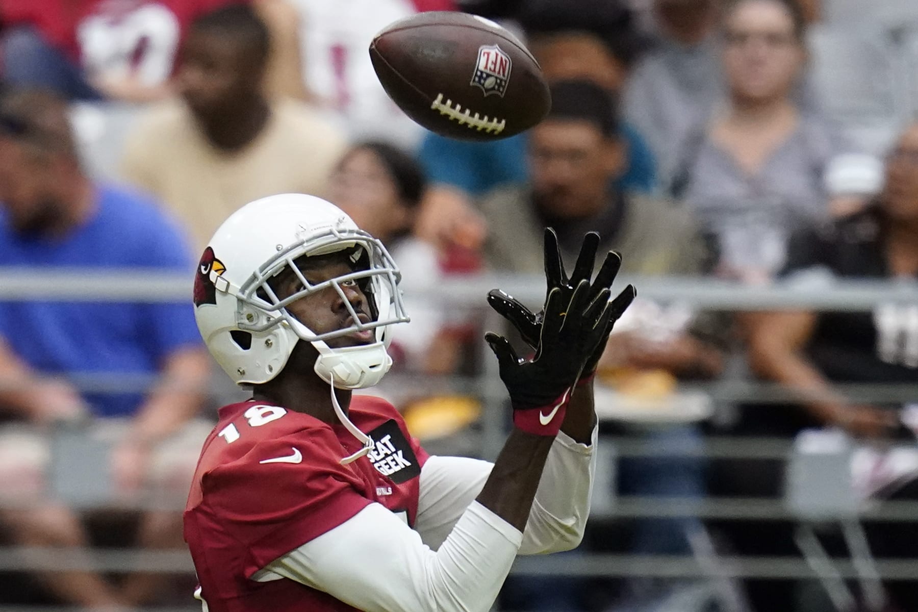 Arizona Cardinals wide receiver A.J. Green reaches out to make a catch as he takes part in drills during the NFL football team's training camp at State Farm Stadium, Saturday, July 30, 2022, in Glendale, Ariz. (AP Photo/Ross D. Franklin)