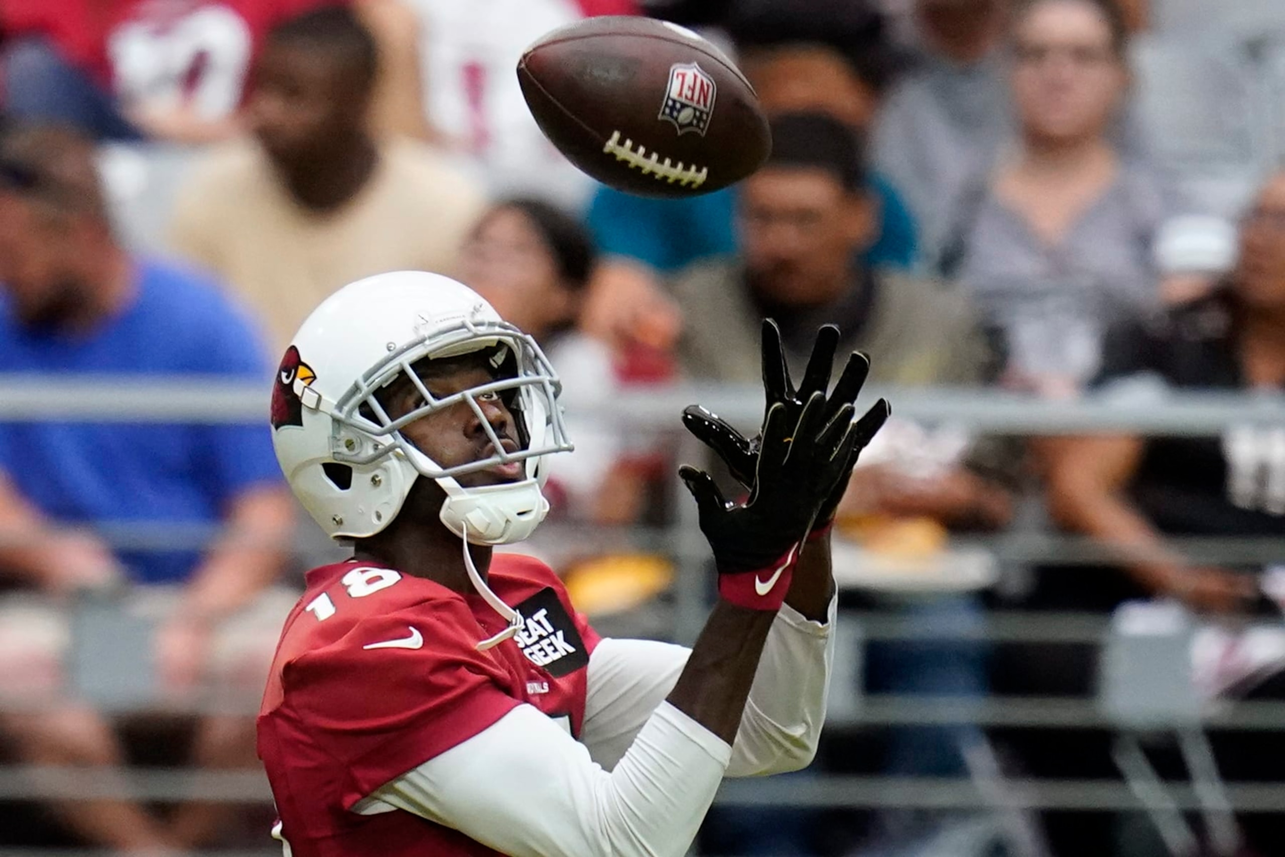 Arizona Cardinals wide receiver A.J. Green reaches out to make a catch as he takes part in drills during the NFL football team's training camp at State Farm Stadium, Saturday, July 30, 2022, in Glendale, Ariz. (AP Photo/Ross D. Franklin)