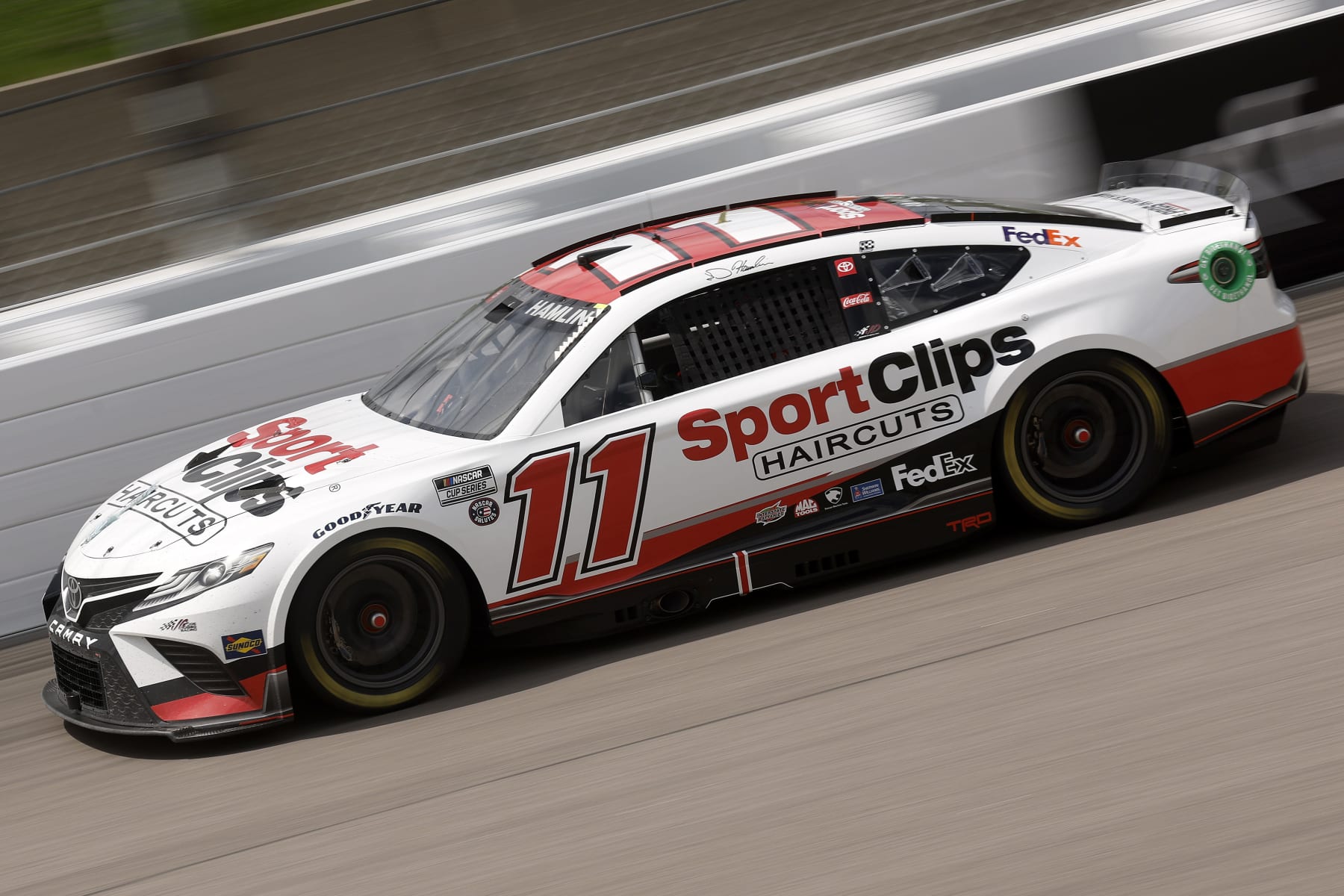KANSAS CITY, KANSAS - MAY 15: Denny Hamlin, driver of the #11 Sport Clips Haircuts Toyota, drives during the NASCAR Cup Series AdventHealth 400 at Kansas Speedway on May 15, 2022 in Kansas City, Kansas. (Photo by Chris Graythen/Getty Images)
