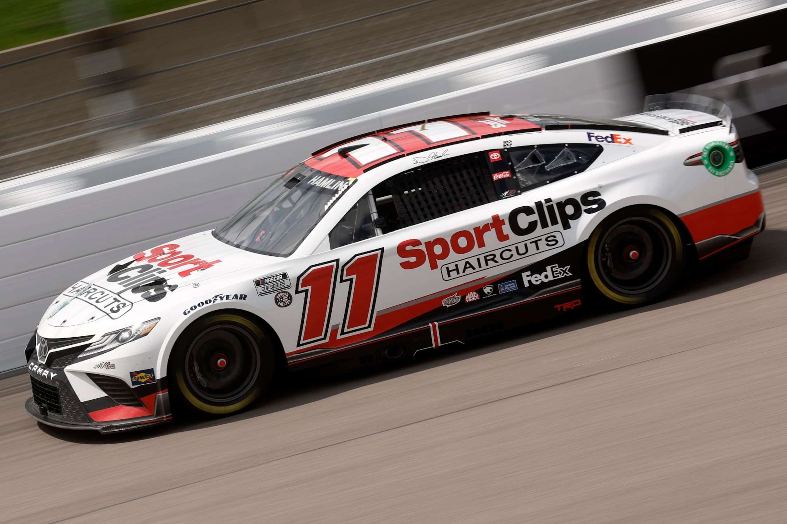 KANSAS CITY, KANSAS - MAY 15: Denny Hamlin, driver of the #11 Sport Clips Haircuts Toyota, drives during the NASCAR Cup Series AdventHealth 400 at Kansas Speedway on May 15, 2022 in Kansas City, Kansas. (Photo by Chris Graythen/Getty Images)