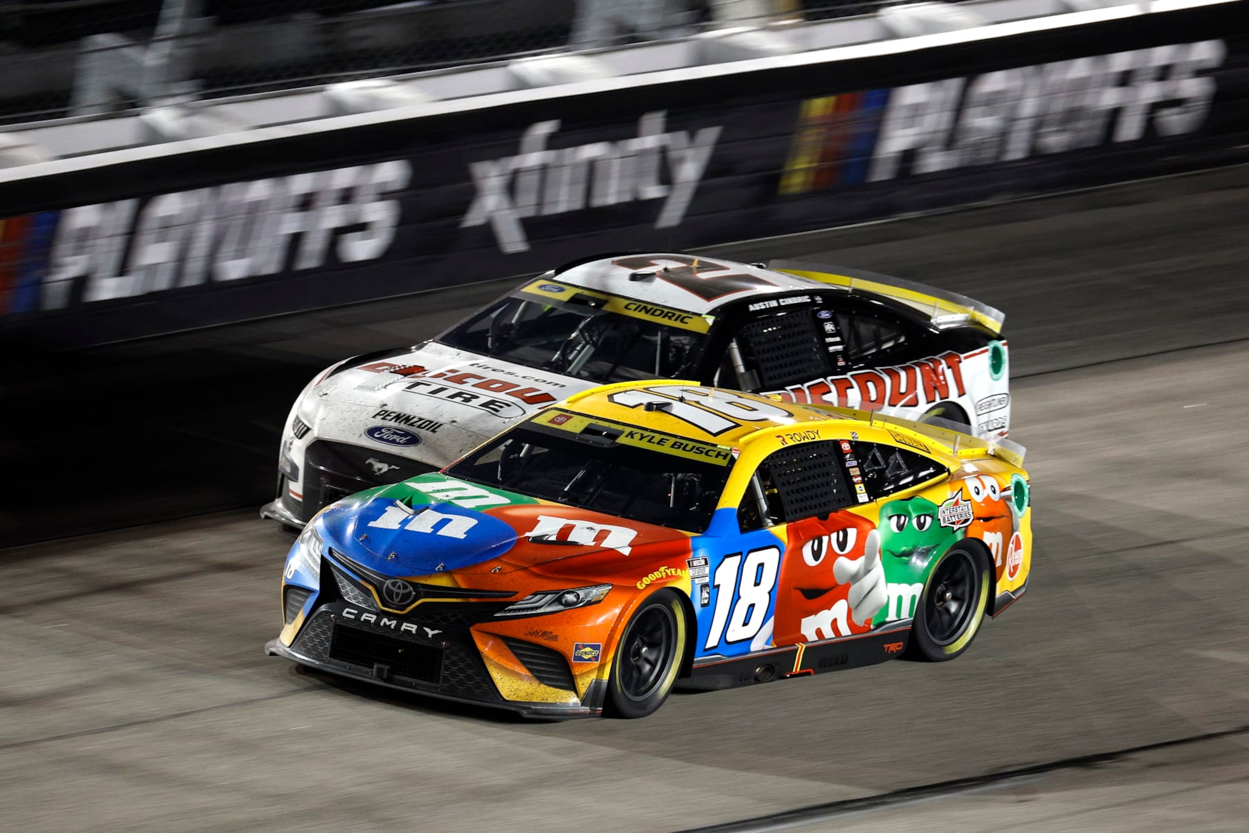DARLINGTON, SOUTH CAROLINA - SEPTEMBER 04: Kyle Busch, driver of the #18 M&M's Toyota, and Austin Cindric, driver of the #2 Discount Tire Ford, race during the NASCAR Cup Series Cook Out Southern 500 at Darlington Raceway on September 04, 2022 in Darlington, South Carolina. (Photo by Jared C. Tilton/Getty Images)