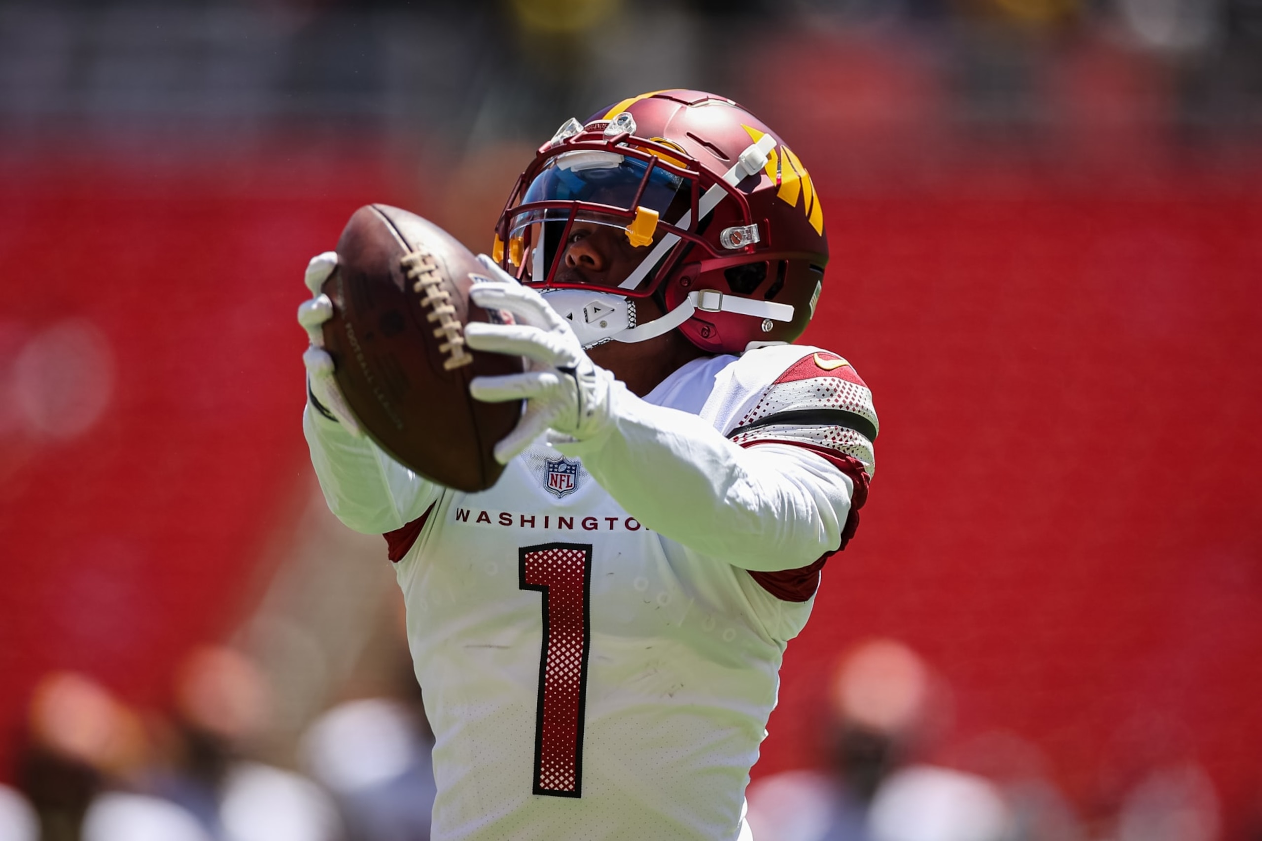 LANDOVER, MD - AUGUST 13: Jahan Dotson #1 of the Washington Commanders warms up before the preseason game against the Carolina Panthers at FedExField on August 13, 2022 in Landover, Maryland. (Photo by Scott Taetsch/Getty Images)