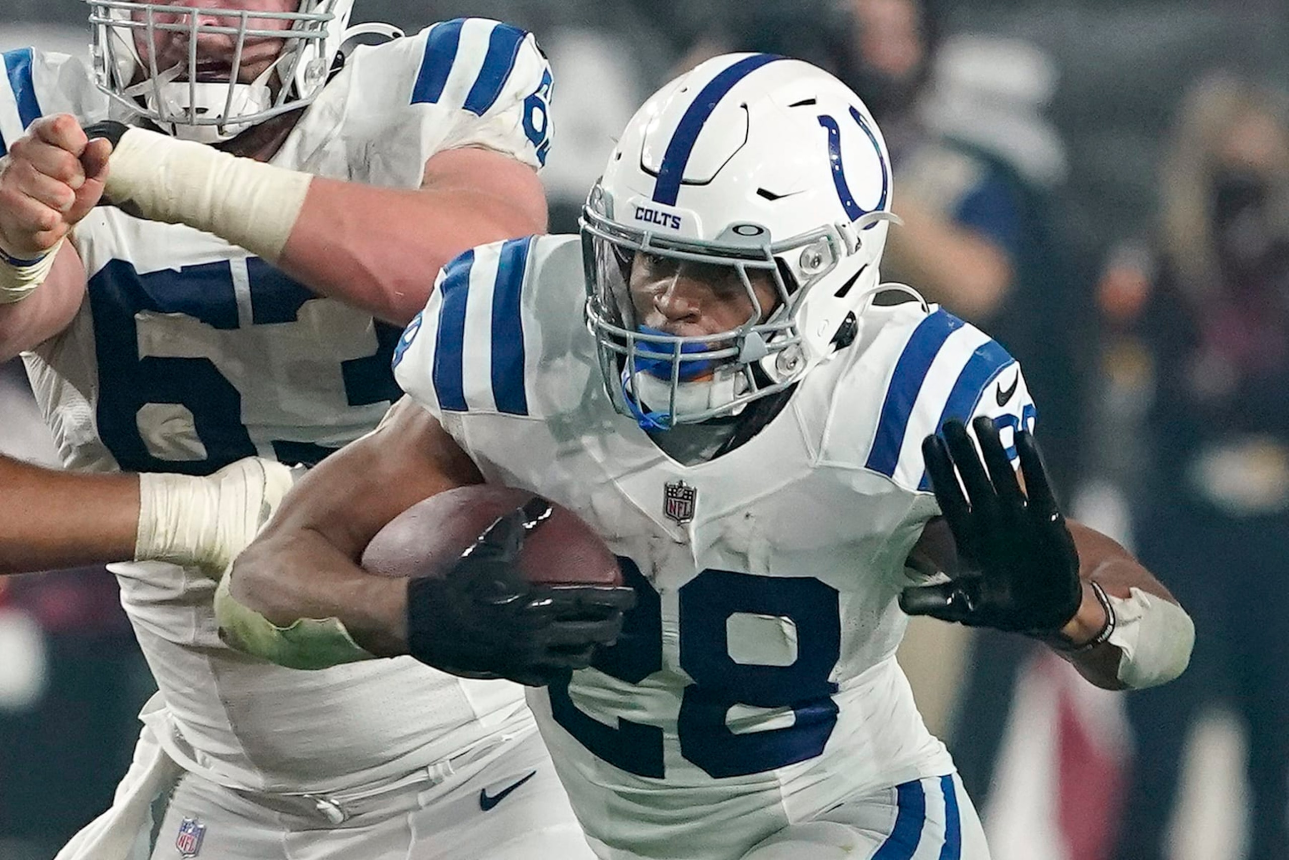 FILE - Indianapolis Colts running back Jonathan Taylor (28) plays against the Arizona Cardinals during an NFL football game on Dec. 25, 2021, in Glendale, Ariz. Taylor was named to The Associated Press 2021 NFL All-Pro Team, announced Friday, Jan. 14, 2022.(AP Photo/Darryl Webb, File)