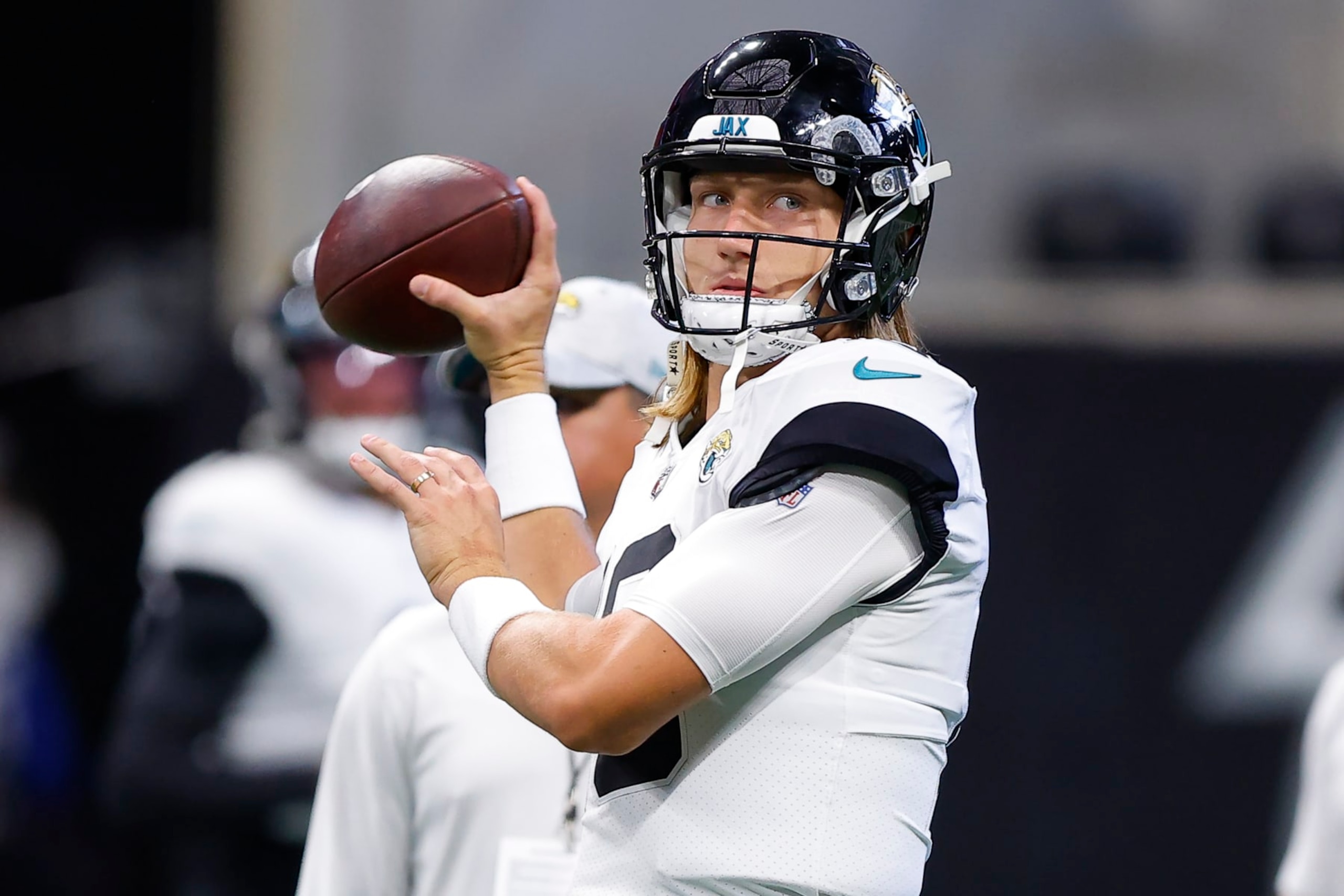 ATLANTA, GA - AUGUST 27: Trevor Lawrence #16 of the Jacksonville Jaguars warms up prior to a preseason game against the Atlanta Falcons at Mercedes-Benz Stadium on August 27, 2022 in Atlanta, Georgia. (Photo by Todd Kirkland/Getty Images)