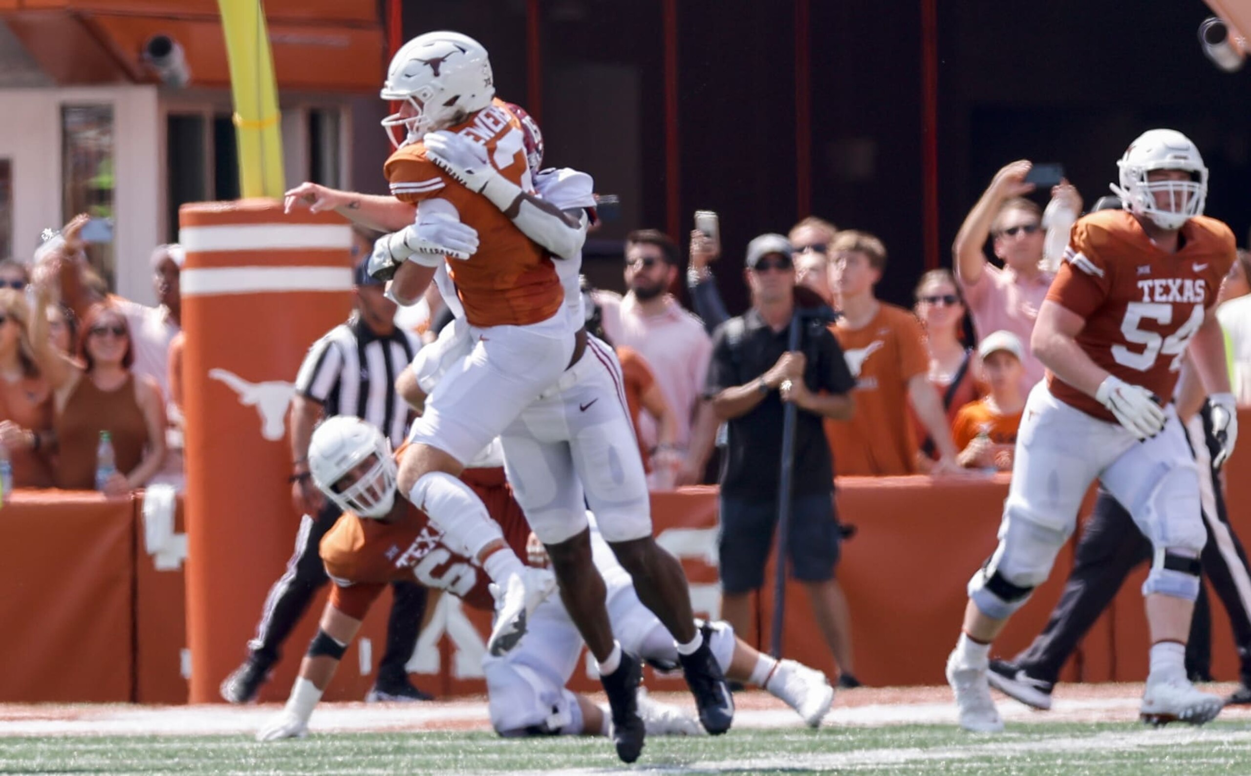 AUSTIN, TEXAS - SEPTEMBER 10: Dallas Turner #15 of the Alabama Crimson Tide hits Quinn Ewers #3 of the Texas Longhorns late resulting in a roughing the passer penalty in the first half at Darrell K Royal-Texas Memorial Stadium on September 10, 2022 in Austin, Texas. (Photo by Tim Warner/Getty Images)