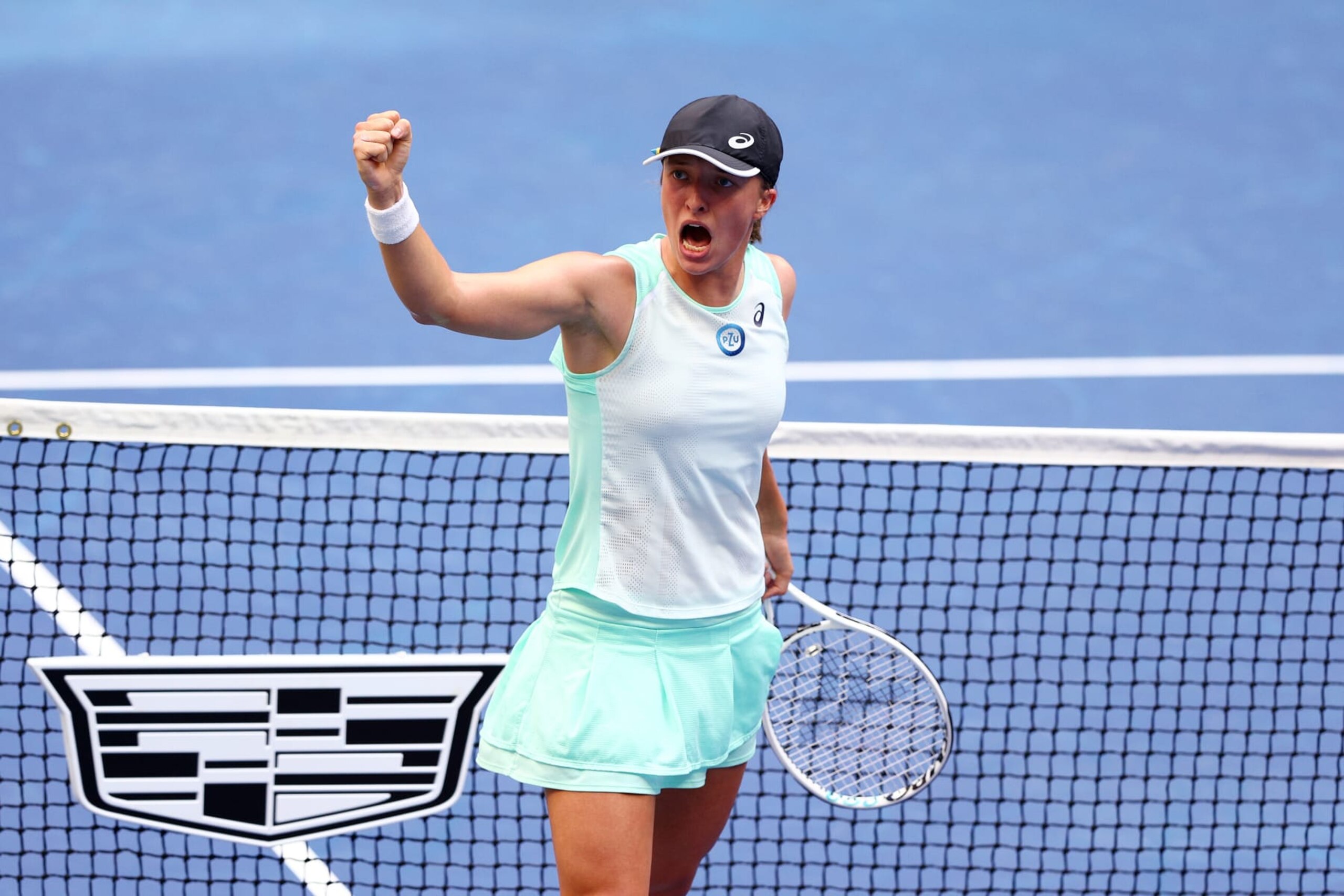 NEW YORK, NEW YORK - SEPTEMBER 10: Iga Swiatek of Poland celebrates a point against Ons Jabeur of Tunisia during their Women’s Singles Final match on Day Thirteen of the 2022 US Open at USTA Billie Jean King National Tennis Center on September 10, 2022 in the Flushing neighborhood of the Queens borough of New York City. (Photo by Elsa/Getty Images)