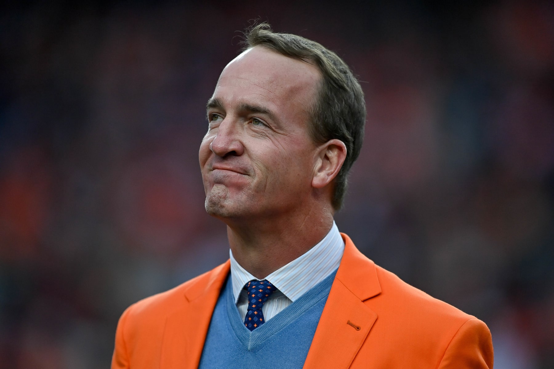 DENVER, CO - OCTOBER 31: Former Denver Broncos quarterback Peyton Manning looks on during a ceremony to reveal his name on the stadium Ring of Fame at halftime during a game between the Denver Broncos and the Washington Football Team at Empower Field at Mile High on October 31, 2021 in Denver, Colorado. (Photo by Dustin Bradford/Icon Sportswire via Getty Images) DENVER, CO - OCTOBER 31: Former Denver Broncos quarterback Peyton Manning looks on during a ceremony to reveal his name on the stadium Ring of Fame at halftime during a game between the Denver Broncos and the Washington Football Team at Empower Field at Mile High on October 31, 2021 in Denver, Colorado. (Photo by Dustin Bradford/Icon Sportswire via Getty Images)