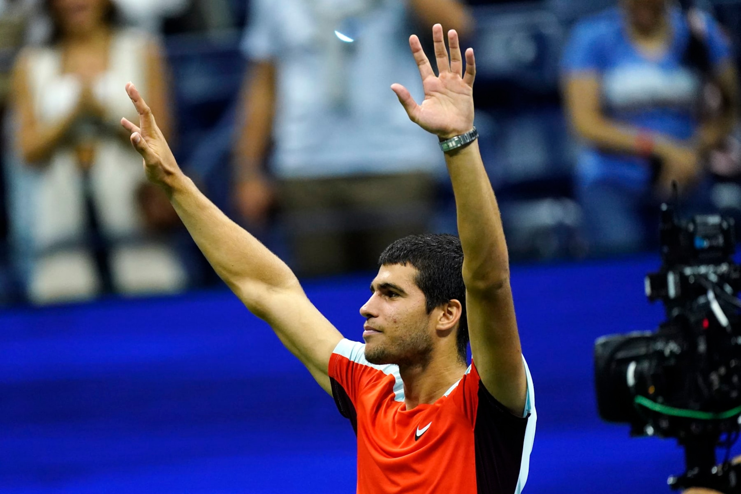 Carlos Alcaraz, of Spain, gestures to the crowd after defeating Frances Tiafoe, of the United States, during the semifinals of the U.S. Open tennis championships, Friday, Sept. 9, 2022, in New York. (AP Photo/Matt Rourke)