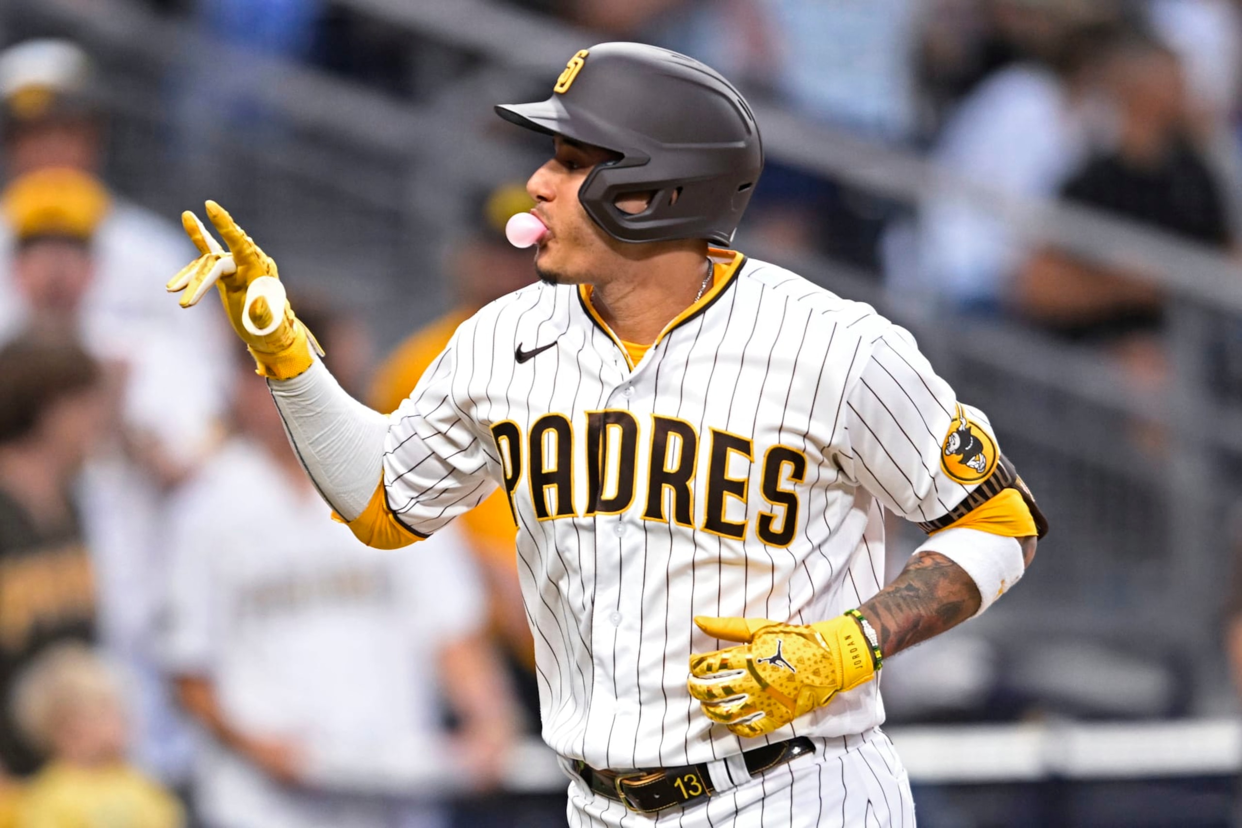SAN DIEGO, CA - SEPTEMBER 10: Manny Machado #13 of the San Diego Padres blows a bubble after hitting a solo home run during the third inning of a baseball game against the Los Angeles Dodgers September 10, 2022 at Petco Park in San Diego, California. (Photo by Denis Poroy/Getty Images)