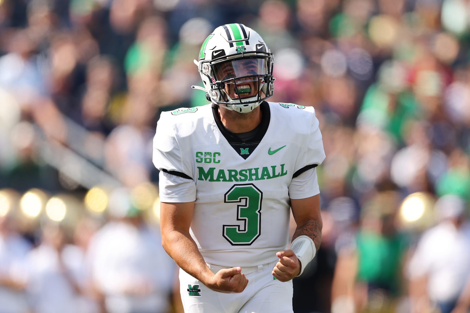 SOUTH BEND, INDIANA - SEPTEMBER 10: Henry Colombi #3 of the Marshall Thundering Herd celebrates a touchdown by Khalan Laborn #8 (not pictured) against the Notre Dame Fighting Irish during the first half at Notre Dame Stadium on September 10, 2022 in South Bend, Indiana. (Photo by Michael Reaves/Getty Images)