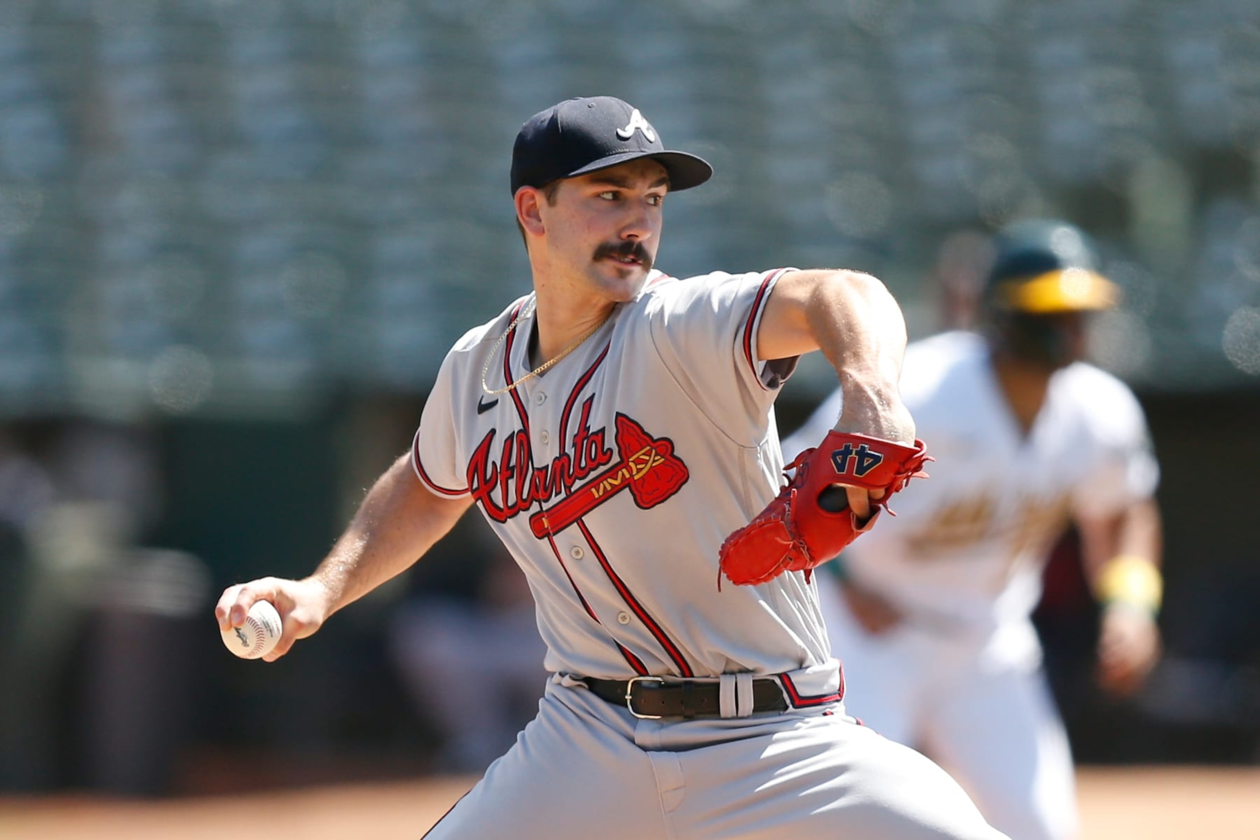 OAKLAND, CALIFORNIA - SEPTEMBER 07: Spencer Strider #65 of the Atlanta Braves pitches against the Oakland Athletics in the bottom of the first inning at RingCentral Coliseum on September 07, 2022 in Oakland, California. (Photo by Lachlan Cunningham/Getty Images)
