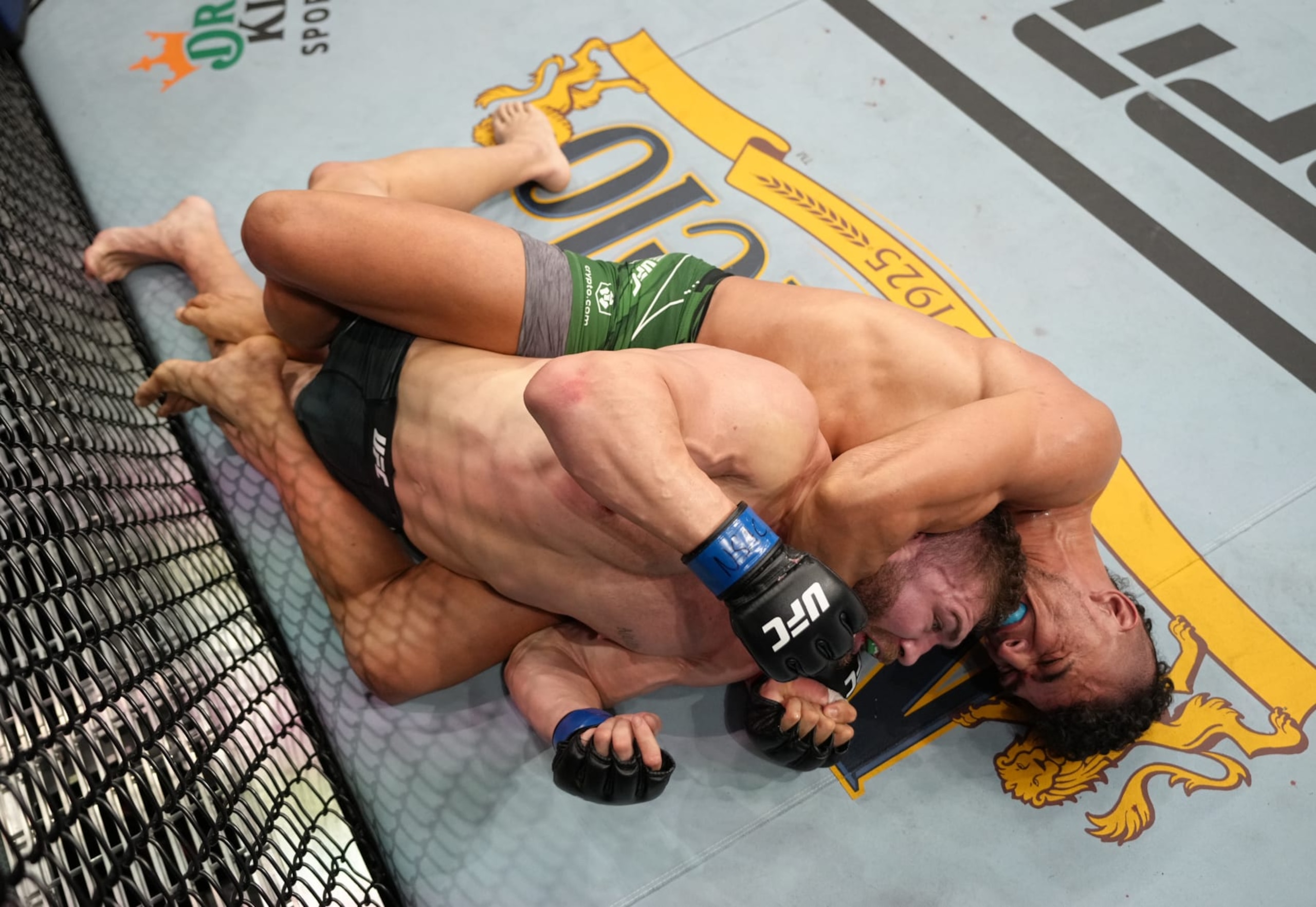 LAS VEGAS, NEVADA - SEPTEMBER 10: (R-L) Johnny Walker of Brazil secures a choke against Ion Cutelaba of Moldova in a heavyweight fight during the UFC 279 event at T-Mobile Arena on September 10, 2022 in Las Vegas, Nevada. (Photo by Jeff Bottari/Zuffa LLC) LAS VEGAS, NEVADA - SEPTEMBER 10: (R-L) Johnny Walker of Brazil secures a choke against Ion Cutelaba of Moldova in a heavyweight fight during the UFC 279 event at T-Mobile Arena on September 10, 2022 in Las Vegas, Nevada. (Photo by Jeff Bottari/Zuffa LLC)