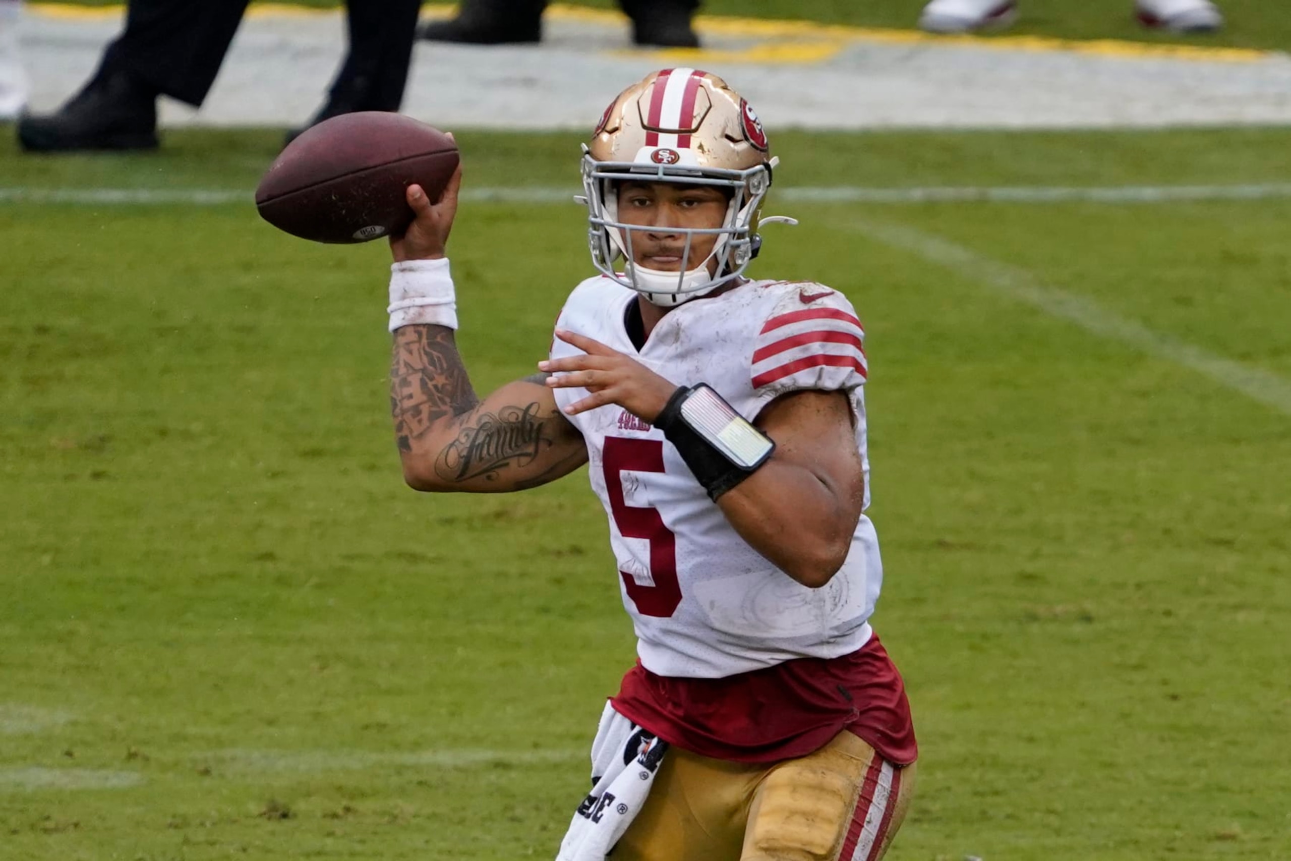 San Francisco 49ers quarterback Trey Lance (5) looks to pass against the Chicago Bears during the second quarter in an NFL football game Sunday, Sept. 11, 2022, in Chicago. (AP Photo/David Banks)