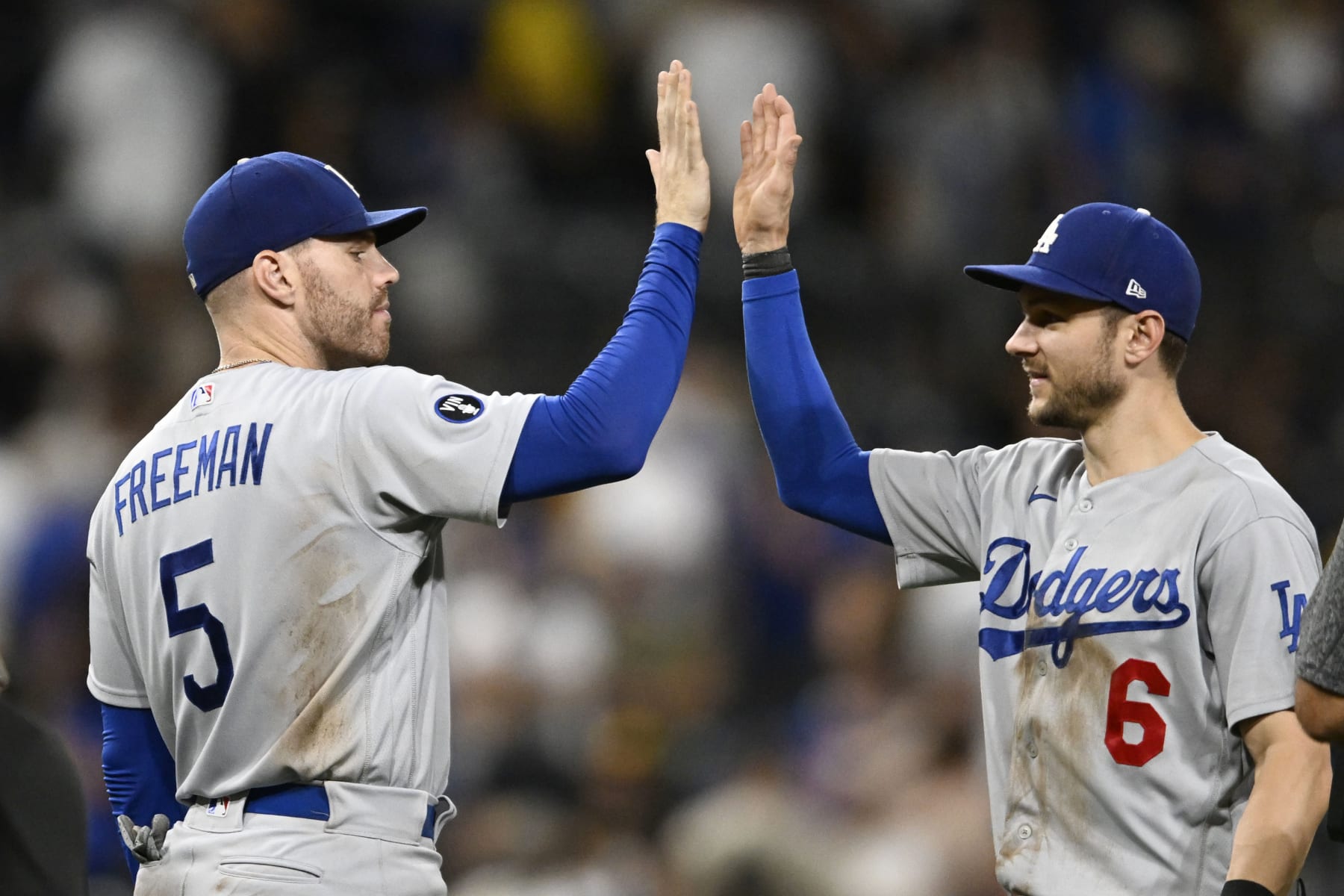 SAN DIEGO, CA - SEPTEMBER 10: Freddie Freeman #5 of the Los Angeles Dodgers, left, high-fives Trea Turner #6 after the Dodgers beat the San Diego Padres 8-4 in a baseball game September 10, 2022 at Petco Park in San Diego, California. (Photo by Denis Poroy/Getty Images)