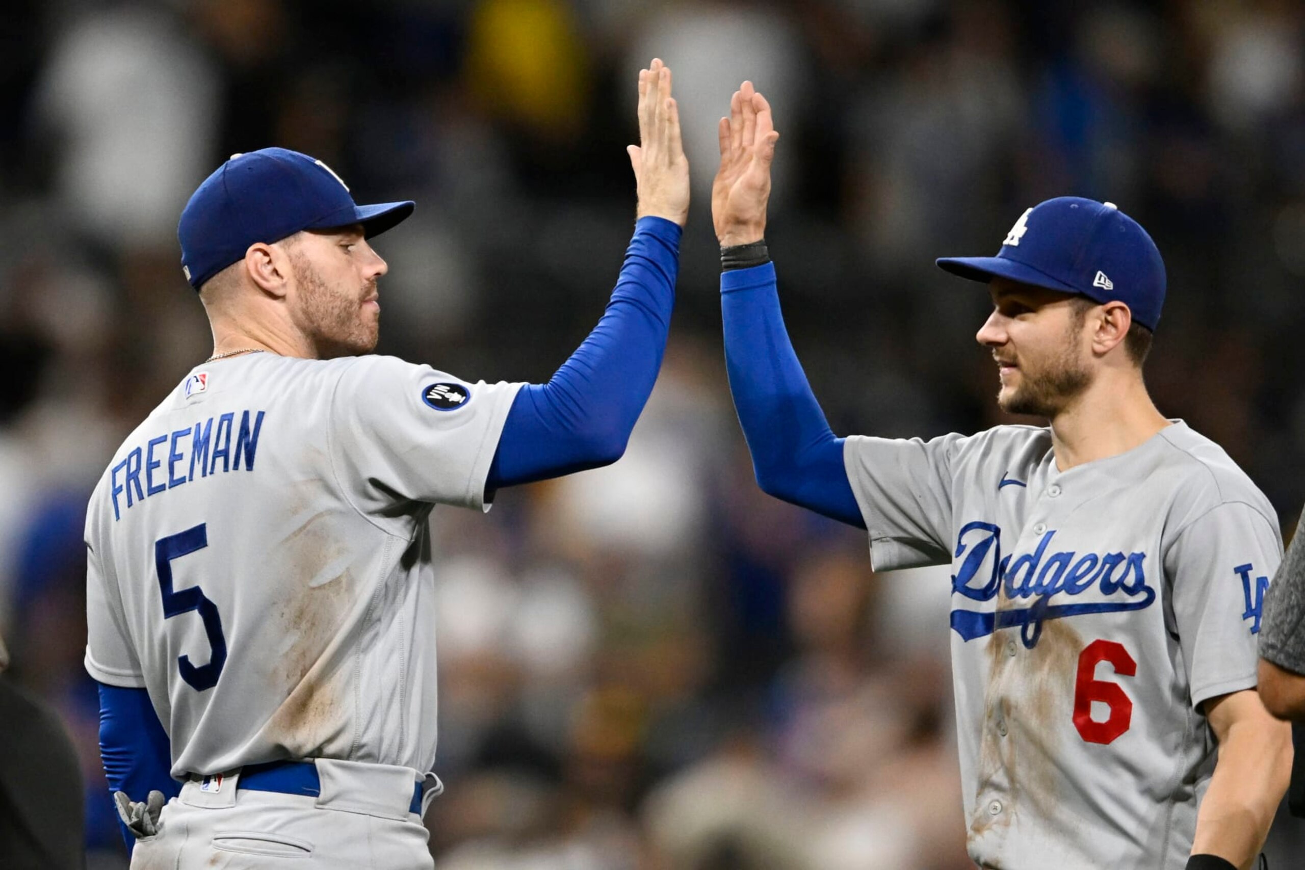 SAN DIEGO, CA - SEPTEMBER 10: Freddie Freeman #5 of the Los Angeles Dodgers, left, high-fives Trea Turner #6 after the Dodgers beat the San Diego Padres 8-4 in a baseball game September 10, 2022 at Petco Park in San Diego, California. (Photo by Denis Poroy/Getty Images)