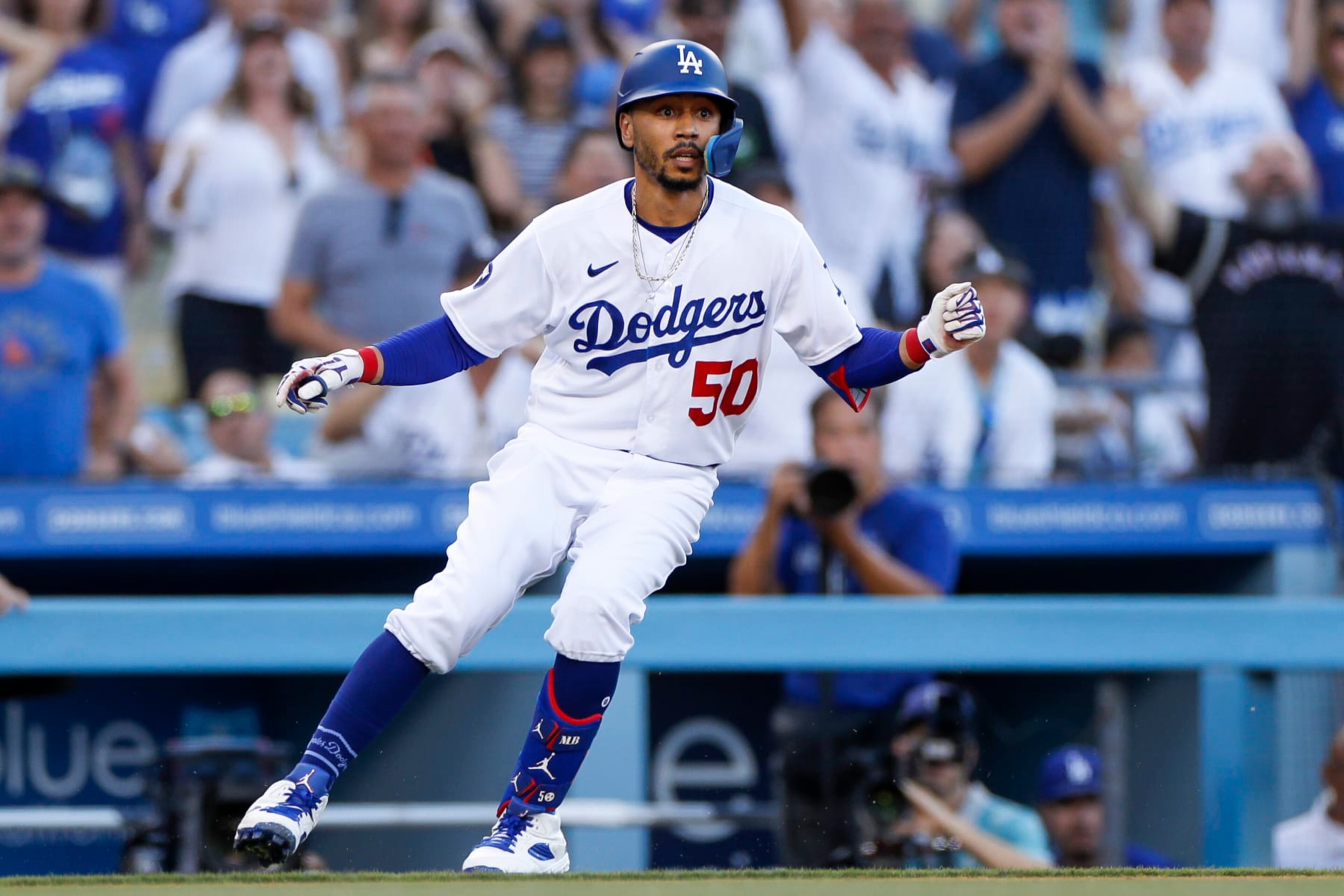 LOS ANGELES, CA - SEPTEMBER 03: Los Angeles Dodgers second basemen Mookie Betts (50) stops at third base with a triple in the first inning during a regular season game between the San Diego Padres and Los Angeles Dodgers on September 03, 2022, at Dodger Stadium in Los Angeles, CA. (Photo by Brandon Sloter/Icon Sportswire via Getty Images)