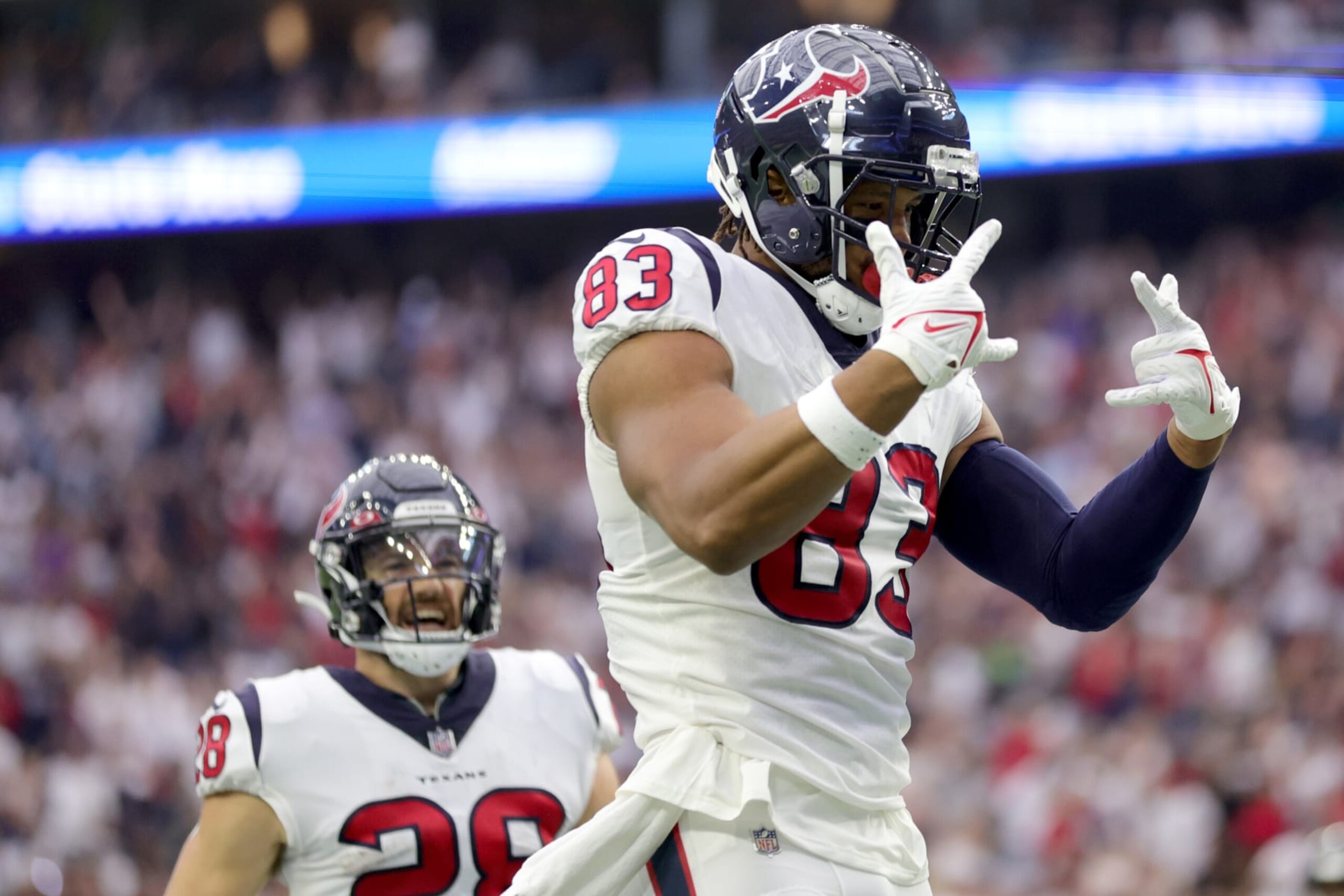HOUSTON, TEXAS - SEPTEMBER 11: O.J. Howard #83 of the Houston Texans celebrates scoring a touchdown during the second quarter against the Indianapolis Colts at NRG Stadium on September 11, 2022 in Houston, Texas. (Photo by Carmen Mandato/Getty Images)