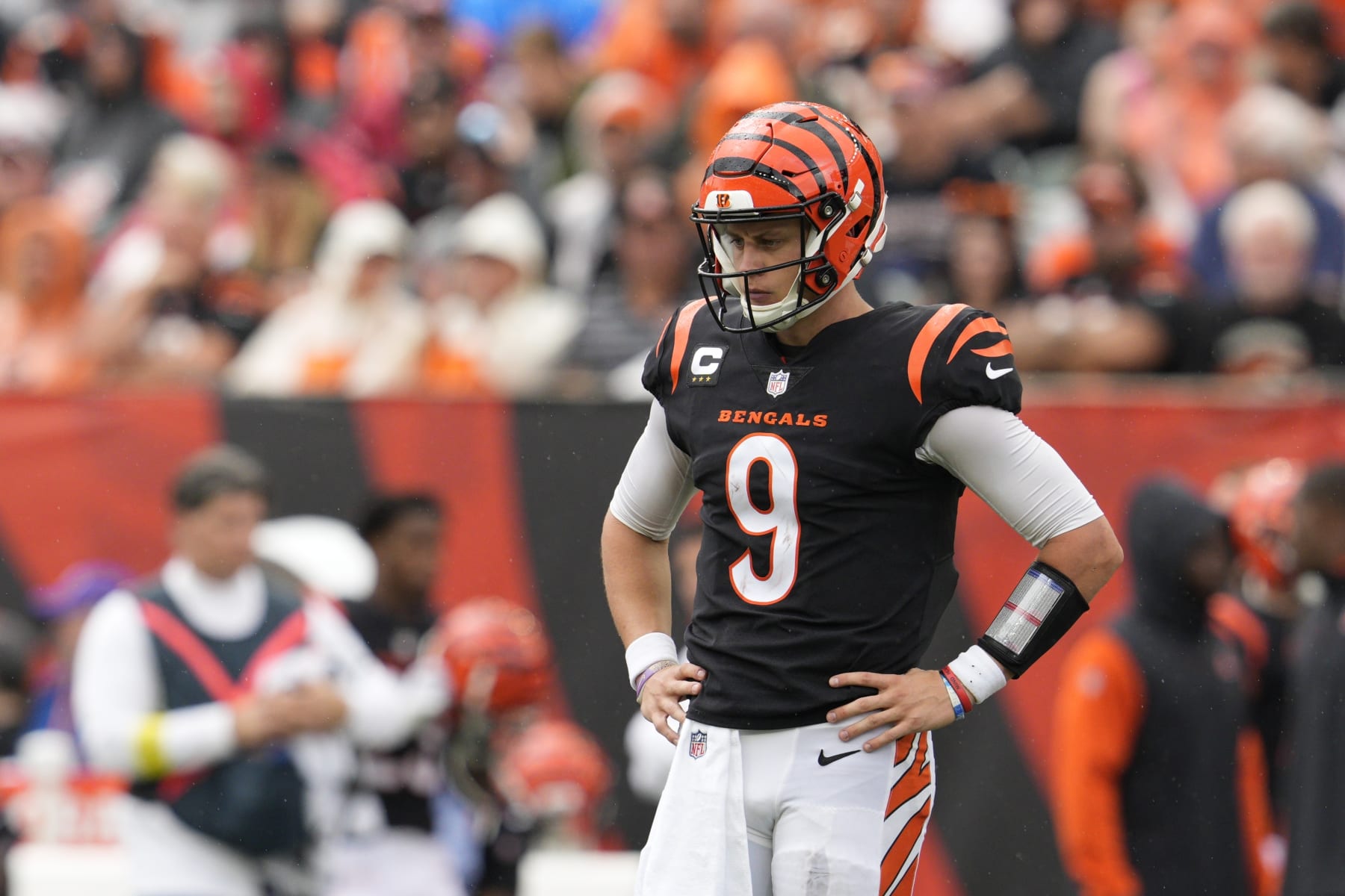 Cincinnati Bengals quarterback Joe Burrow (9) pauses during the first half of an NFL football game against the Pittsburgh Steelers, Sunday, Sept. 11, 2022, in Cincinnati. (AP Photo/Jeff Dean)
