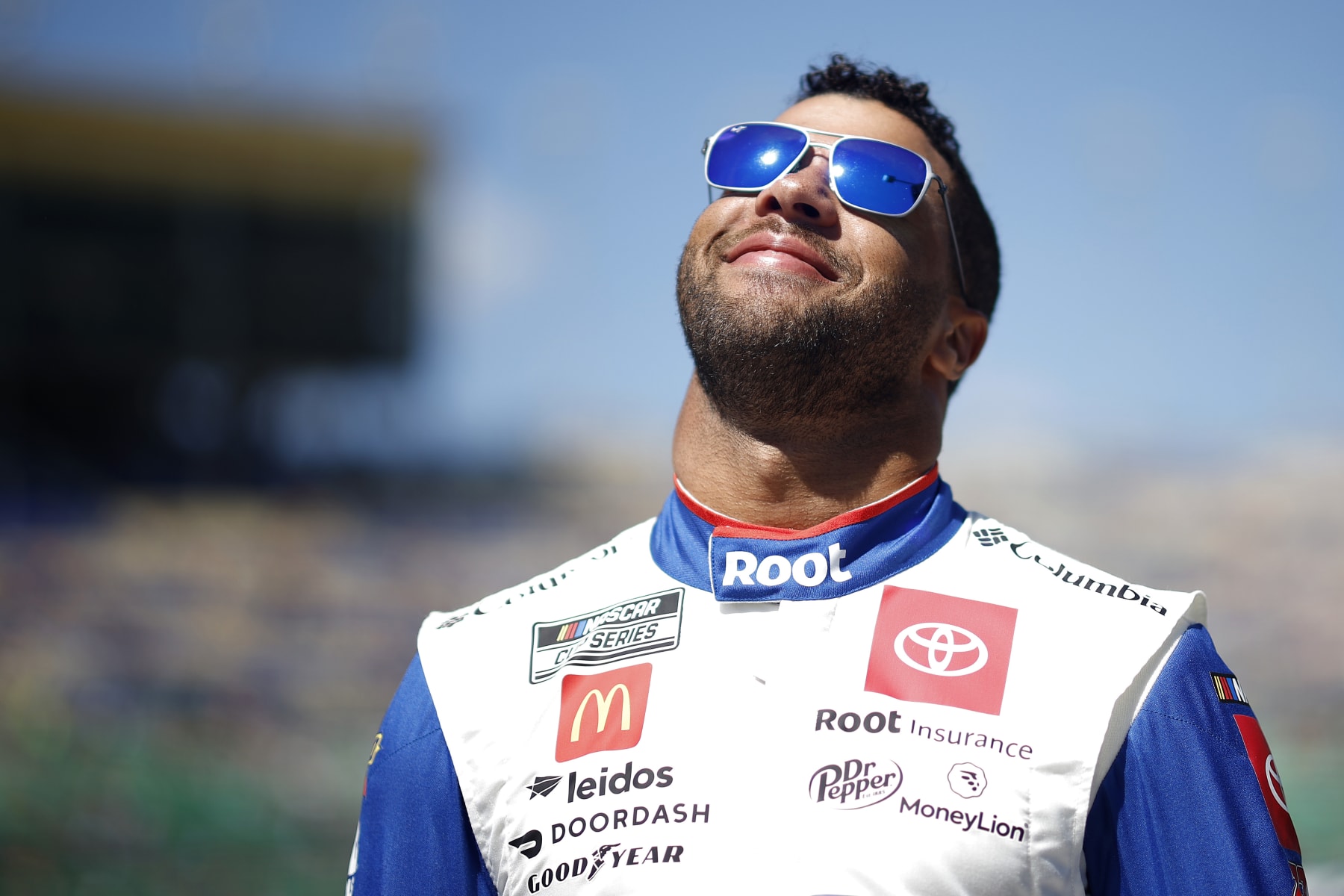 KANSAS CITY, KANSAS - SEPTEMBER 11: Bubba Wallace, driver of the #45 ROOT Insurance Toyota, waits on the grid prior to the NASCAR Cup Series Hollywood Casino 400 at Kansas Speedway on September 11, 2022 in Kansas City, Kansas. (Photo by Chris Graythen/Getty Images)