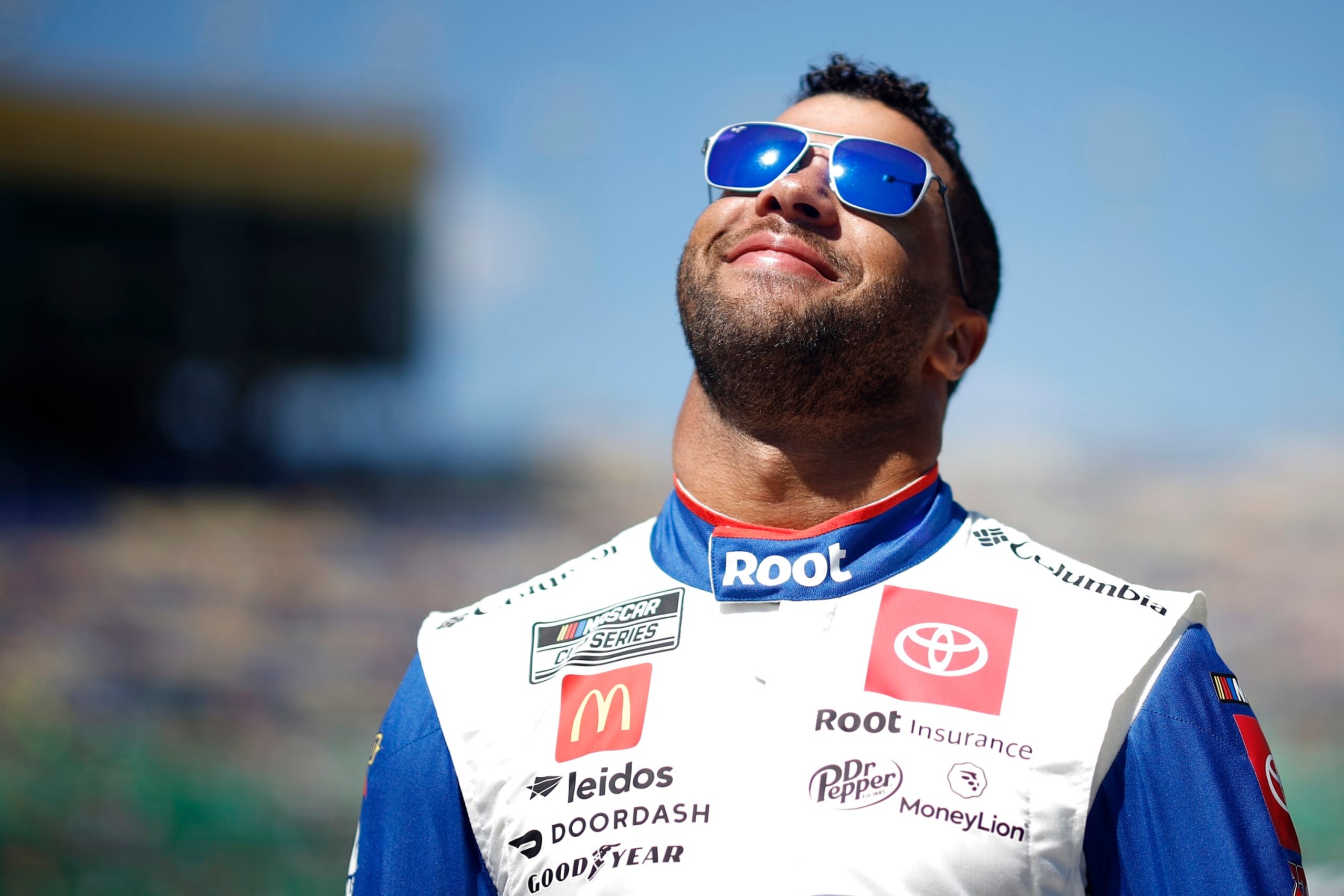 KANSAS CITY, KANSAS - SEPTEMBER 11: Bubba Wallace, driver of the #45 ROOT Insurance Toyota, waits on the grid prior to the NASCAR Cup Series Hollywood Casino 400 at Kansas Speedway on September 11, 2022 in Kansas City, Kansas. (Photo by Chris Graythen/Getty Images)