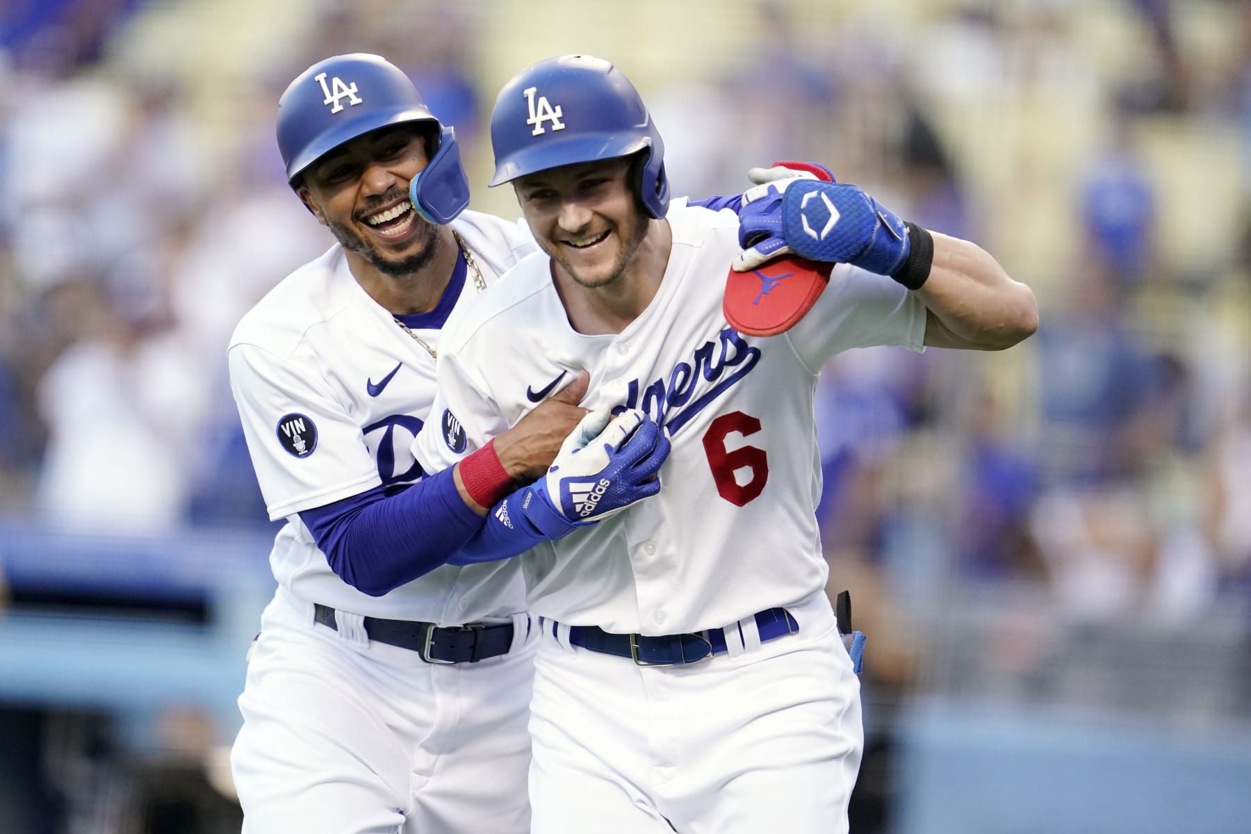Los Angeles Dodgers' Trea Turner, right, celebrates after his two-run home run with Mookie Betts, left, during the first inning of a baseball game against the San Diego Padres, Saturday, Sept. 3, 2022, in Los Angeles. (AP Photo/Marcio Jose Sanchez)
