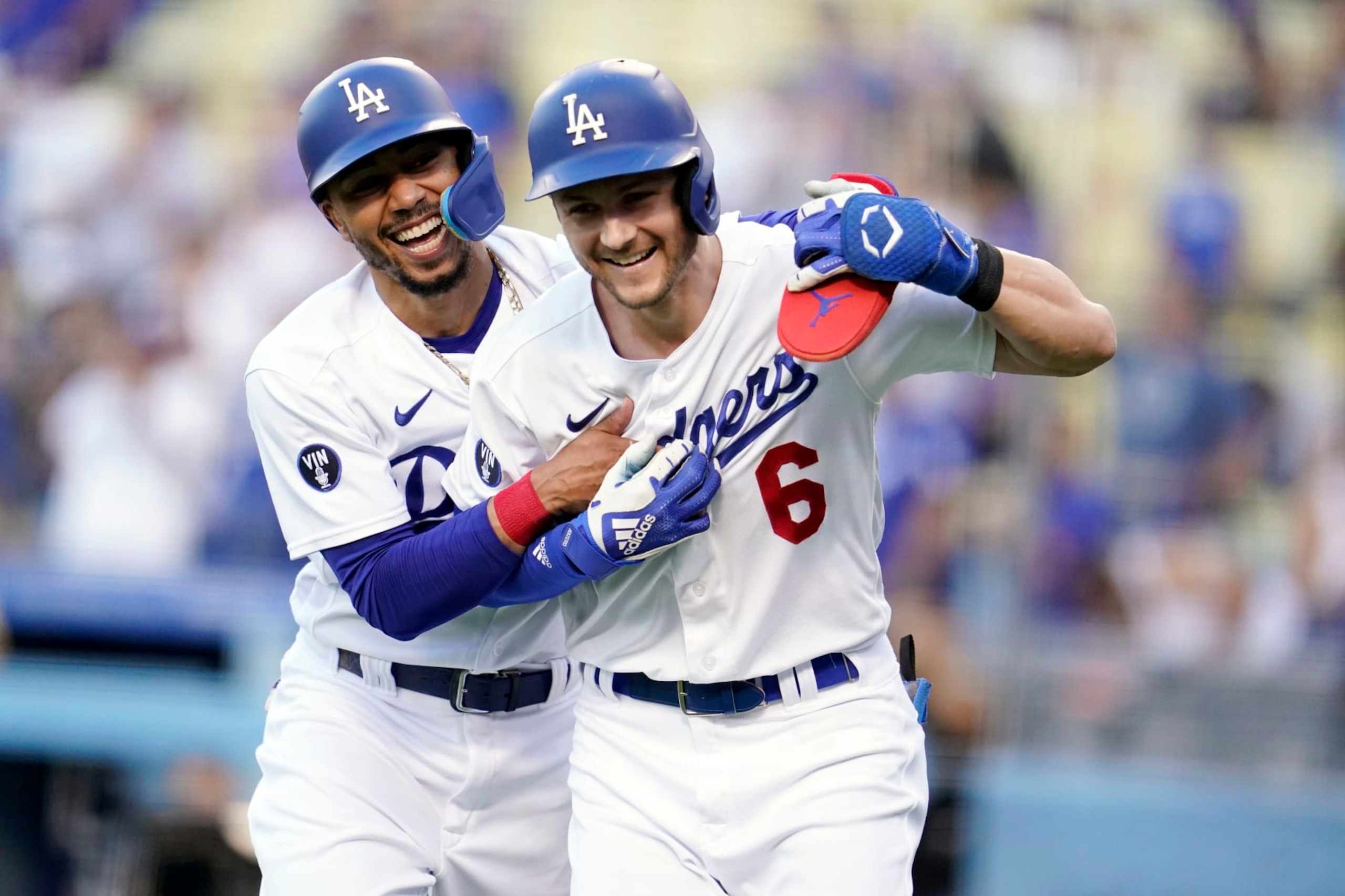 Los Angeles Dodgers' Trea Turner, right, celebrates after his two-run home run with Mookie Betts, left, during the first inning of a baseball game against the San Diego Padres, Saturday, Sept. 3, 2022, in Los Angeles. (AP Photo/Marcio Jose Sanchez)