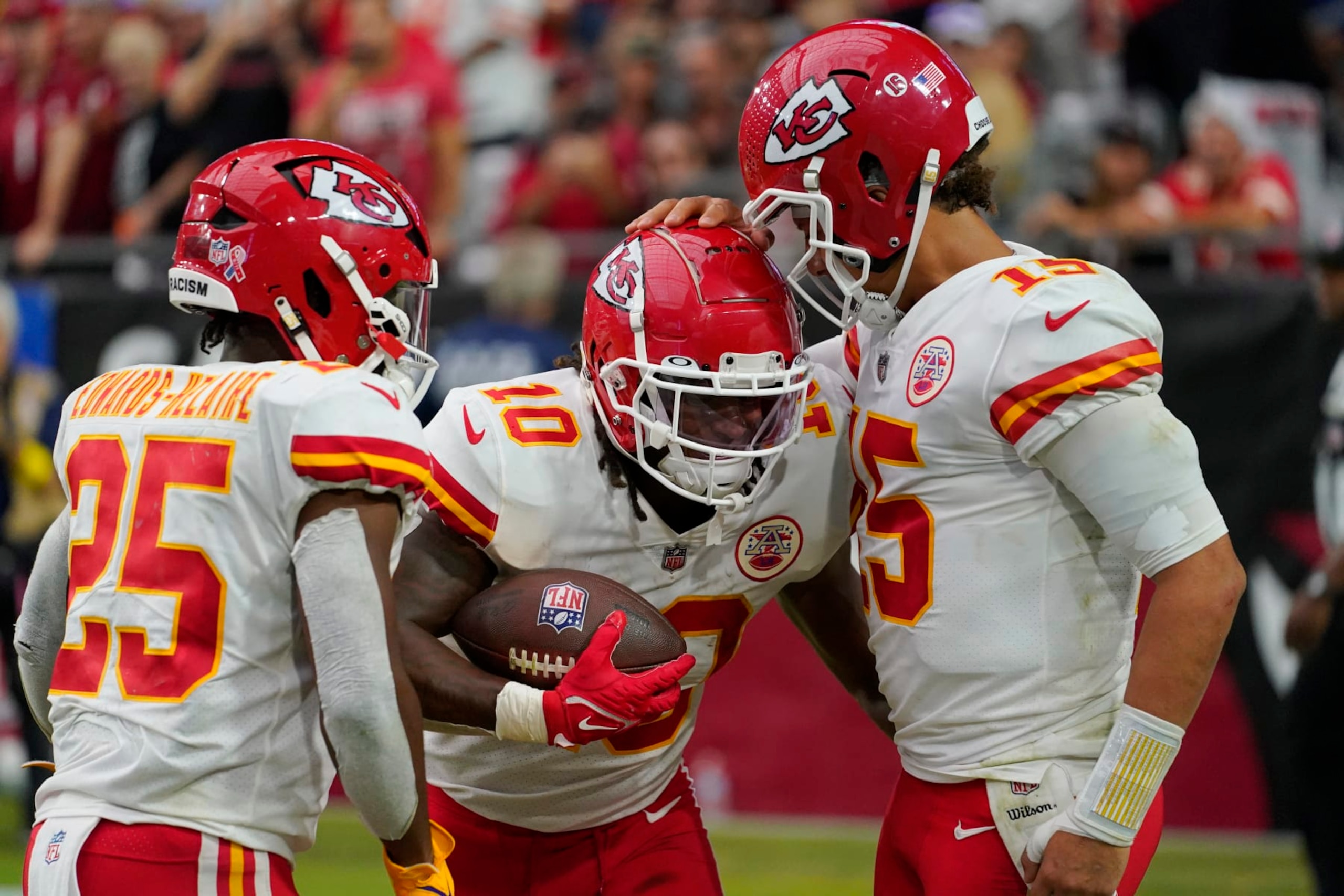 Kansas City Chiefs quarterback Patrick Mahomes, right, celebrates after running back Isiah Pacheco (10) scored a touchdown against the Arizona Cardinals during the second half of an NFL football game, Sunday, Sept. 11, 2022, in Glendale, Ariz. (AP Photo/Matt York)