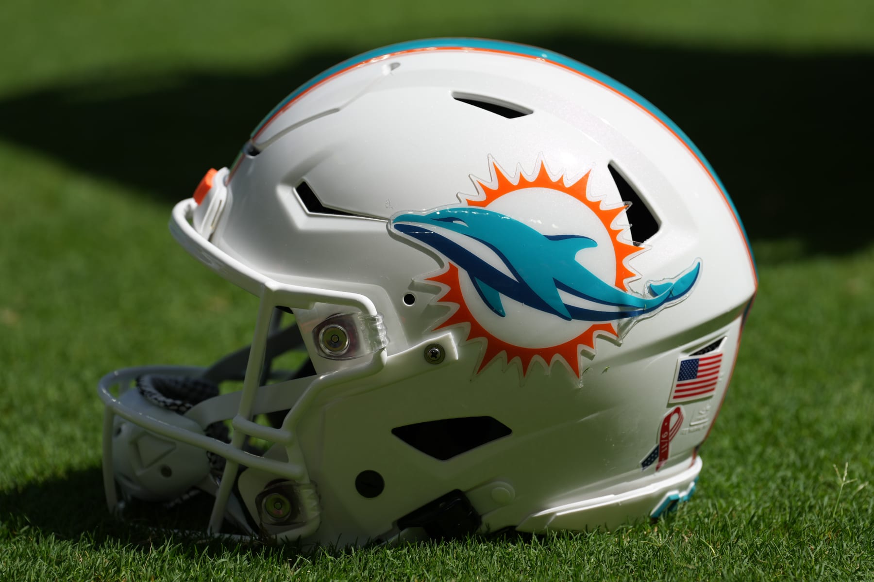 MIAMI GARDENS, FL - September 11: A Miami Dolphins helmet rests on the sidelines during the game between the New England Patriots  and the Miami Dolphins, on Sunday, September 11, 2022 at Hard Rock Stadium in Miami Gardens, FL (Photo by Peter Joneleit/Icon Sportswire via Getty Images)