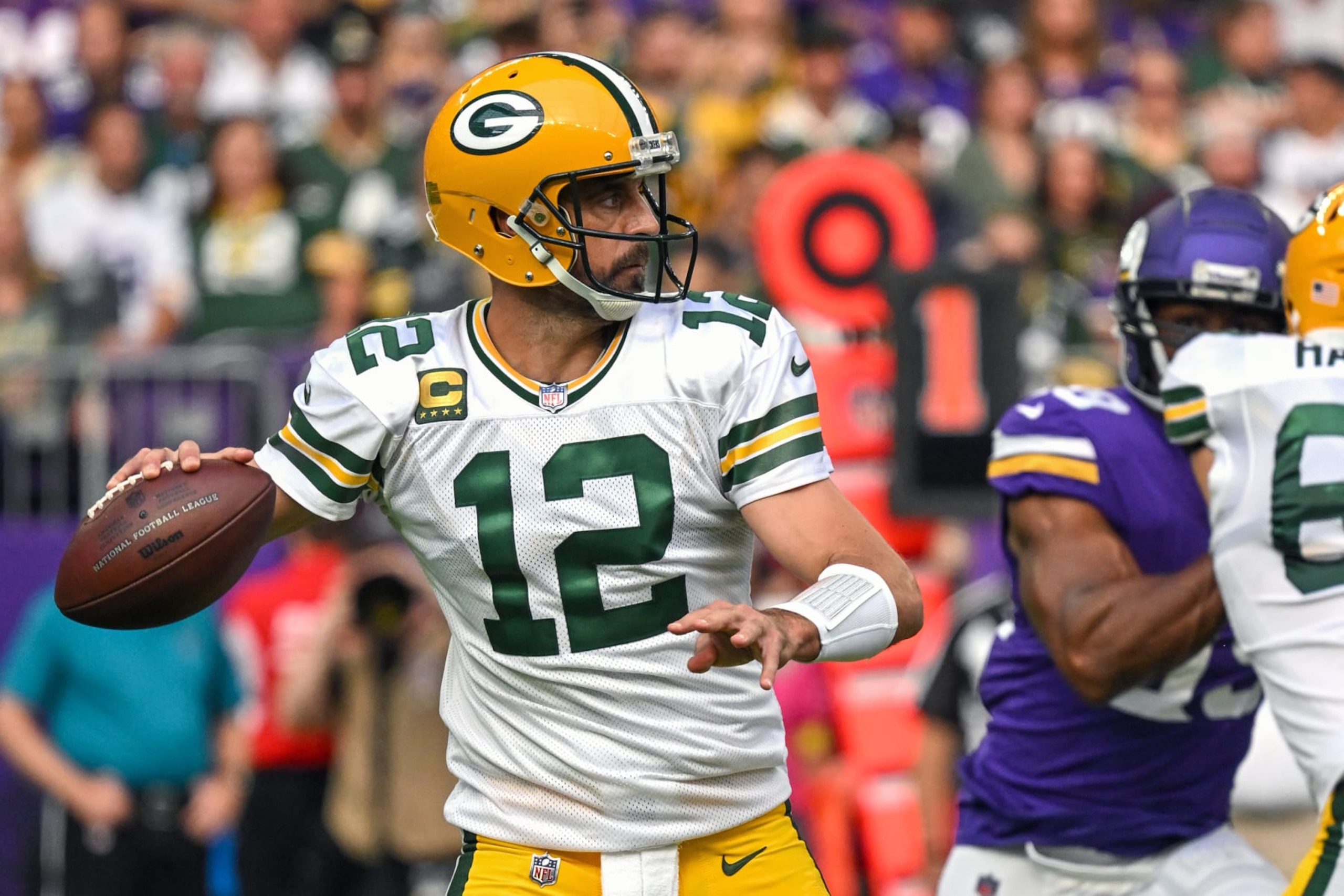 MINNEAPOLIS, MN - SEPTEMBER 11: Green Bay Packers quarterback Aaron Rodgers (12) makes a throw during the second quarter an NFL game between the Minnesota Vikings and Green Bay Packers on September 11, 2022 at U.S. Bank Stadium in Minneapolis, MN.(Photo by Nick Wosika/Icon Sportswire via Getty Images)