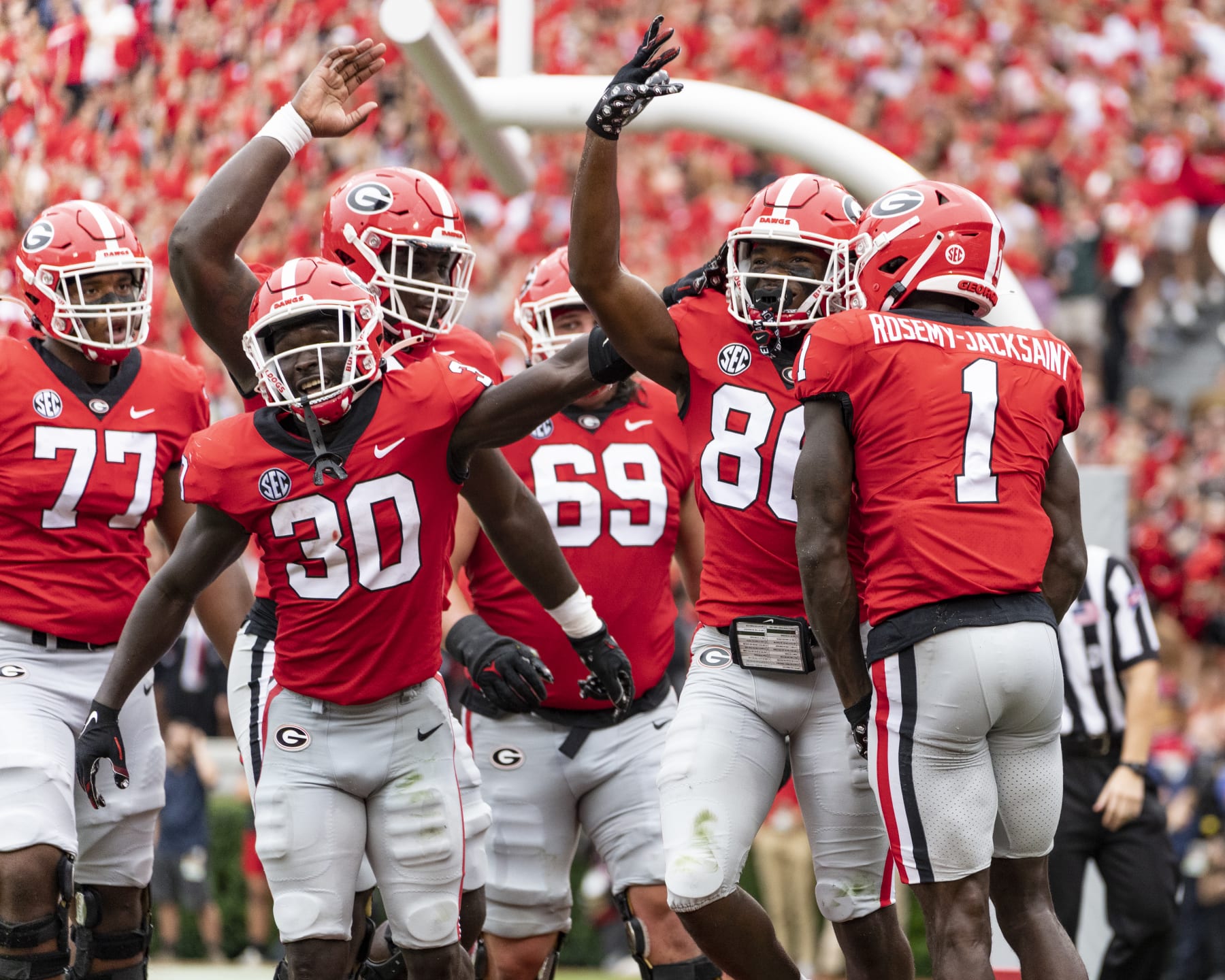 ATHENS, GA - SEPTEMBER 10: Dillon Bell #86 celebrates his touchdown with Marcus Rosemy-Jacksaint #1 and Daijun Edwards #30 of the Georgia Bulldogs during a game between Samford Bulldogs and Georgia Bulldogs at Sanford Stadium on September 10, 2022 in Athens, Georgia. (Photo by Steve Limentani/ISI Photos/Getty Images)