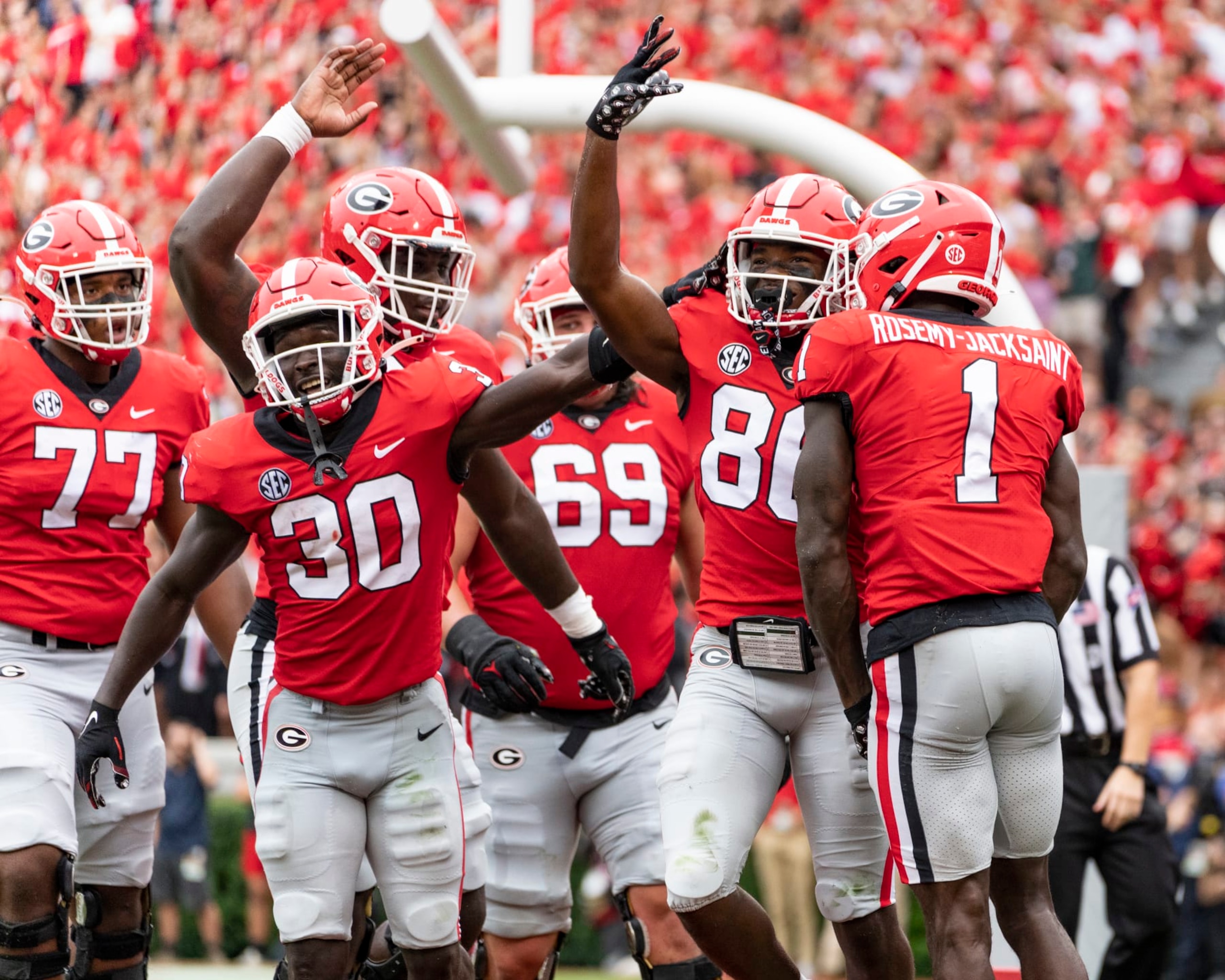 ATHENS, GA - SEPTEMBER 10: Dillon Bell #86 celebrates his touchdown with Marcus Rosemy-Jacksaint #1 and Daijun Edwards #30 of the Georgia Bulldogs during a game between Samford Bulldogs and Georgia Bulldogs at Sanford Stadium on September 10, 2022 in Athens, Georgia. (Photo by Steve Limentani/ISI Photos/Getty Images)