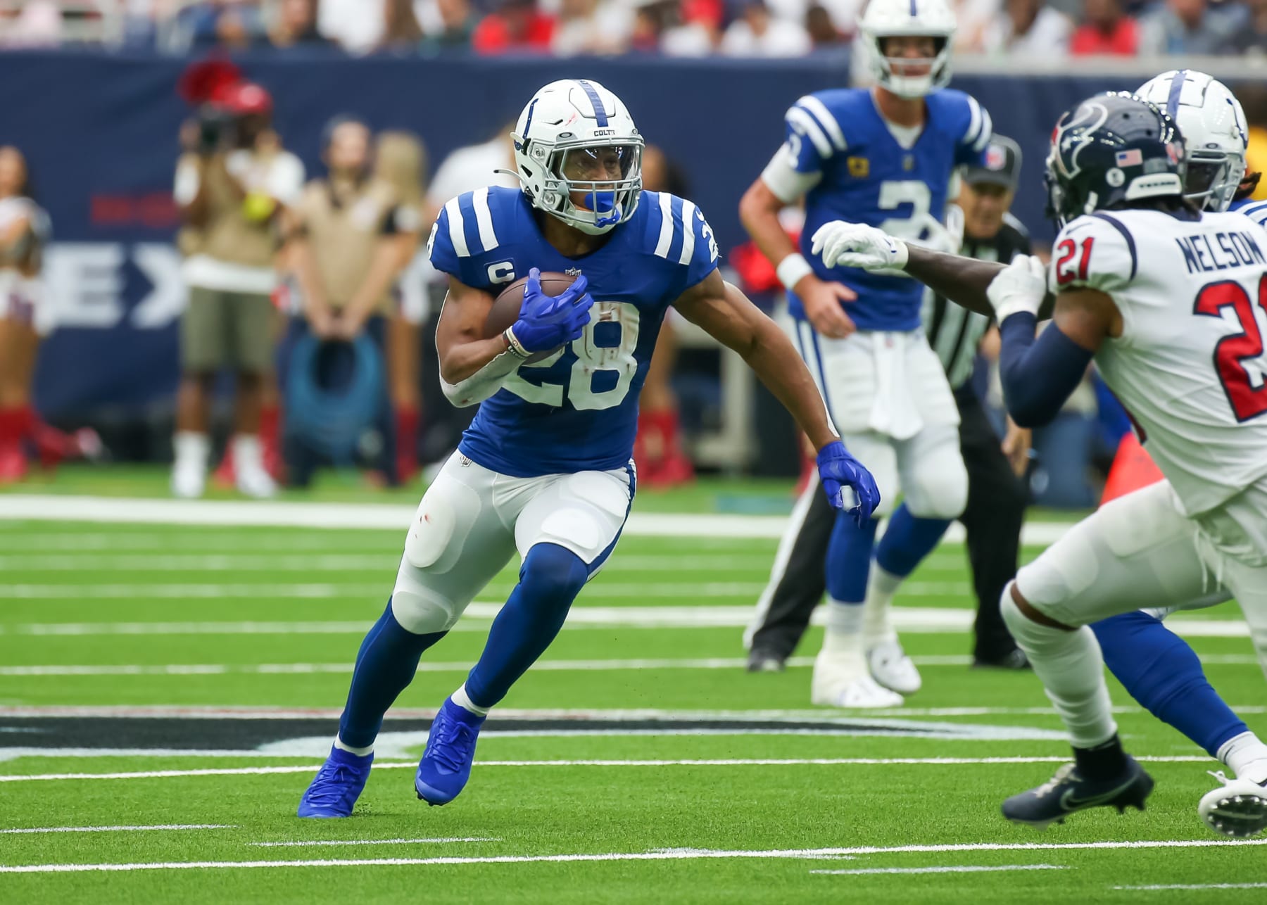 HOUSTON, TX - SEPTEMBER 11:  Indianapolis Colts running back Jonathan Taylor (28) carries the ball in the first quarter during the NFL game between the Indianapolis Colts and Houston Texans on September 11, 2022 at NRG Stadium in Houston, Texas.  (Photo by Leslie Plaza Johnson/Icon Sportswire via Getty Images)