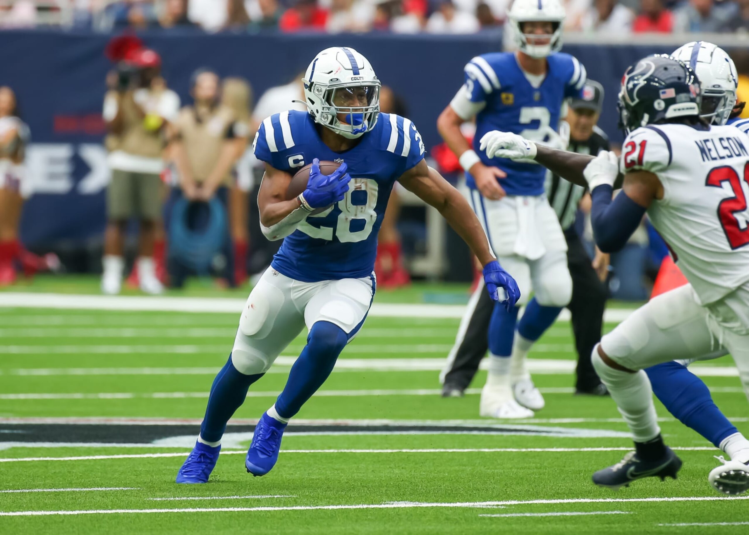 HOUSTON, TX - SEPTEMBER 11:  Indianapolis Colts running back Jonathan Taylor (28) carries the ball in the first quarter during the NFL game between the Indianapolis Colts and Houston Texans on September 11, 2022 at NRG Stadium in Houston, Texas.  (Photo by Leslie Plaza Johnson/Icon Sportswire via Getty Images)