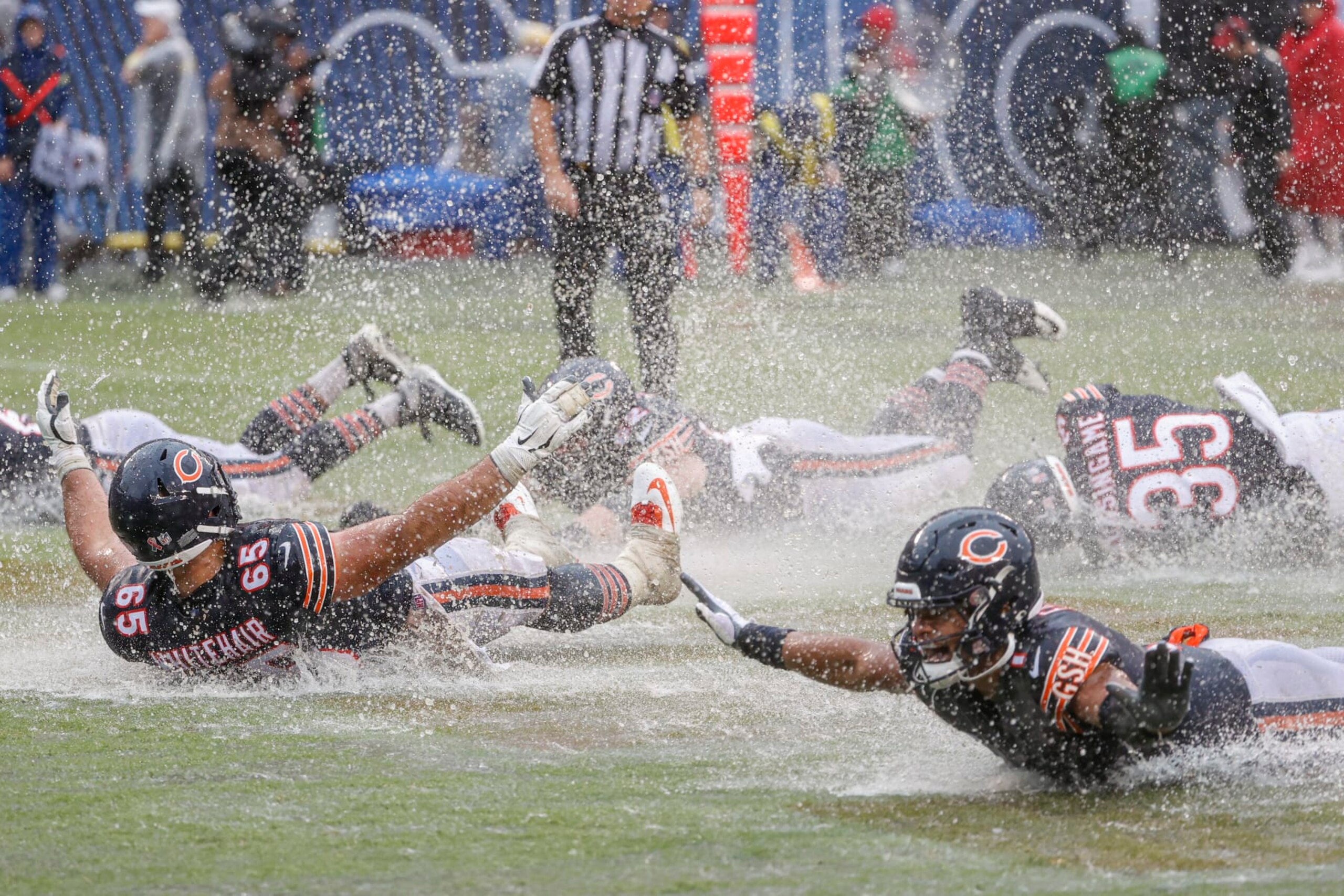 Chicago Bears center Cody Whitehair, left, and quarterback Justin Fields, right, celebrate with teammates the Bears win against the San Francisco 49ers in an NFL football game, Sunday, Sept. 11, 2022, in Chicago. (AP Photo/Kamil Krzaczynski)