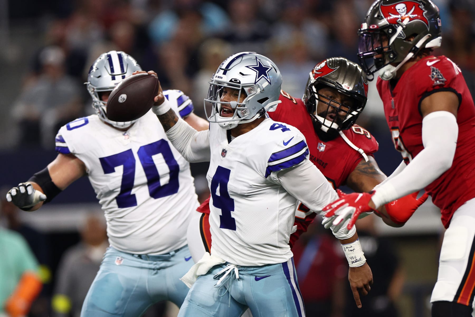 ARLINGTON, TEXAS - SEPTEMBER 11: Dak Prescott #4 of the Dallas Cowboys looks to pass against the Tampa Bay Buccaneers during the first half at AT&T Stadium on September 11, 2022 in Arlington, Texas. (Photo by Tom Pennington/Getty Images)