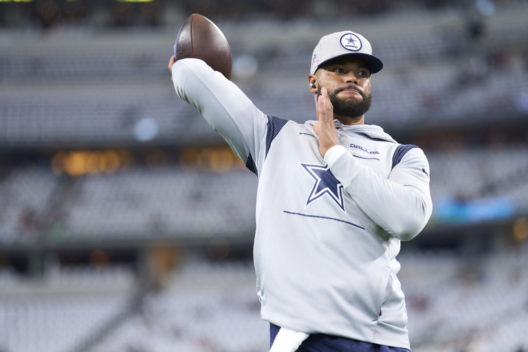 ARLINGTON, TX - SEPTEMBER 11: Dak Prescott #4 of the Dallas Cowboys warms up before kickoff against the Tampa Bay Buccaneers at AT&T Stadium on September 11, 2022 in Arlington, TX. (Photo by Cooper Neill/Getty Images)