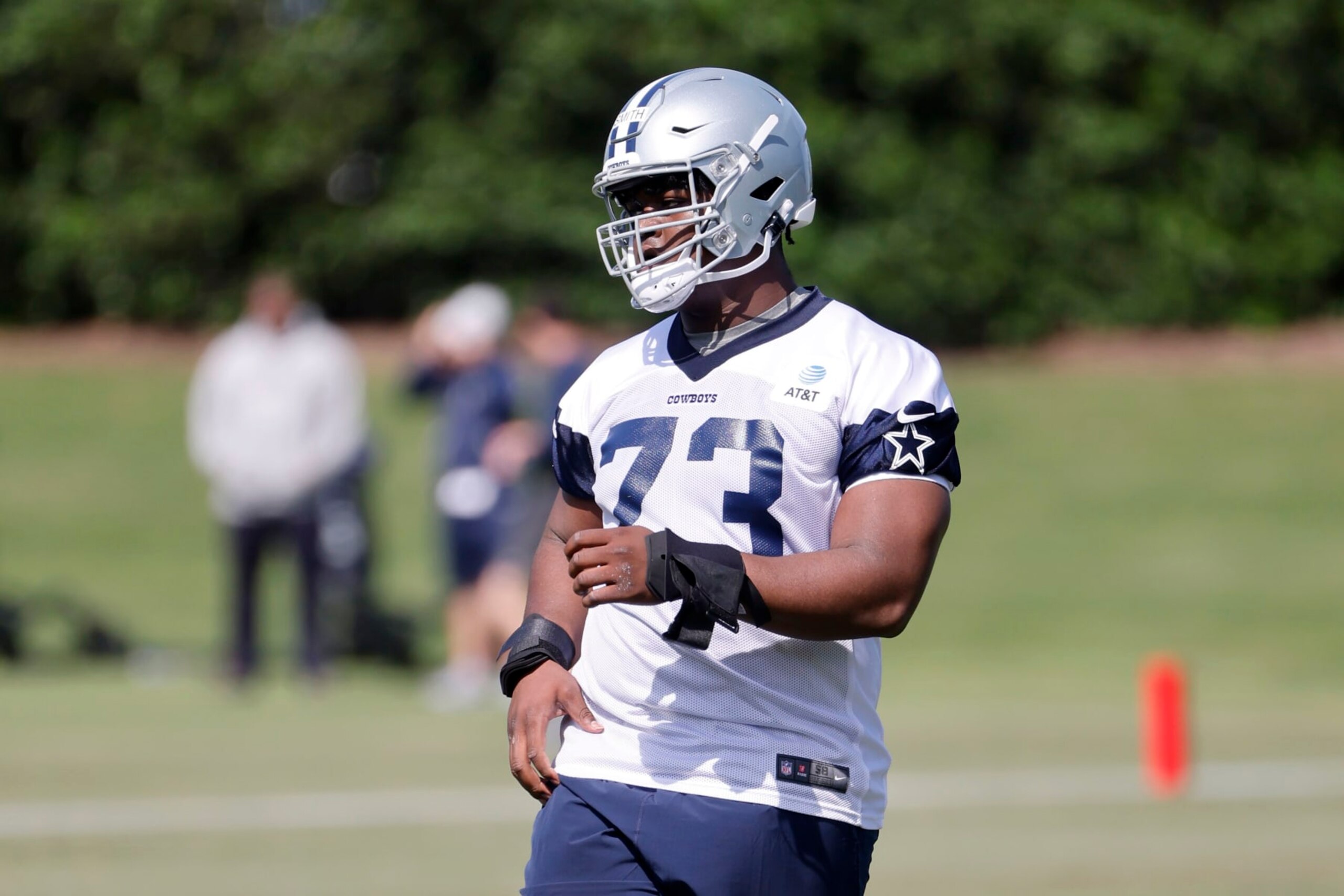 Dallas Cowboys offensive lineman Tyler Smith (73) warms up during the NFL football team's rookie minicamp in Frisco, Texas, Friday, May 13, 2022. (AP Photo/Michael Ainsworth) Dallas Cowboys offensive lineman Tyler Smith (73) warms up during the NFL football team's rookie minicamp in Frisco, Texas, Friday, May 13, 2022. (AP Photo/Michael Ainsworth)
