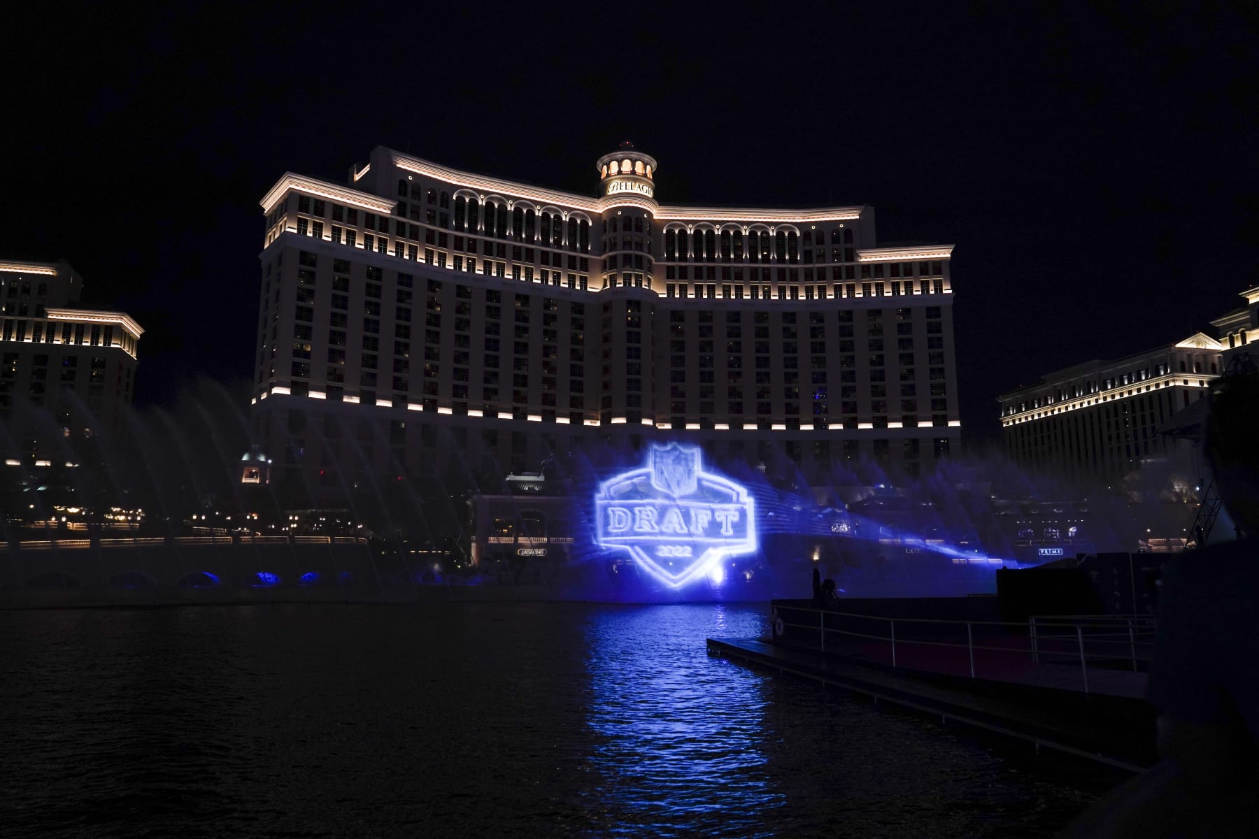 A logo of the 2022 NFL football draft is projected at the Fountains of Bellagio on Wednesday, April 27, 2022, in Las Vegas, the day before the draft. (AP Photo/Jae C. Hong)